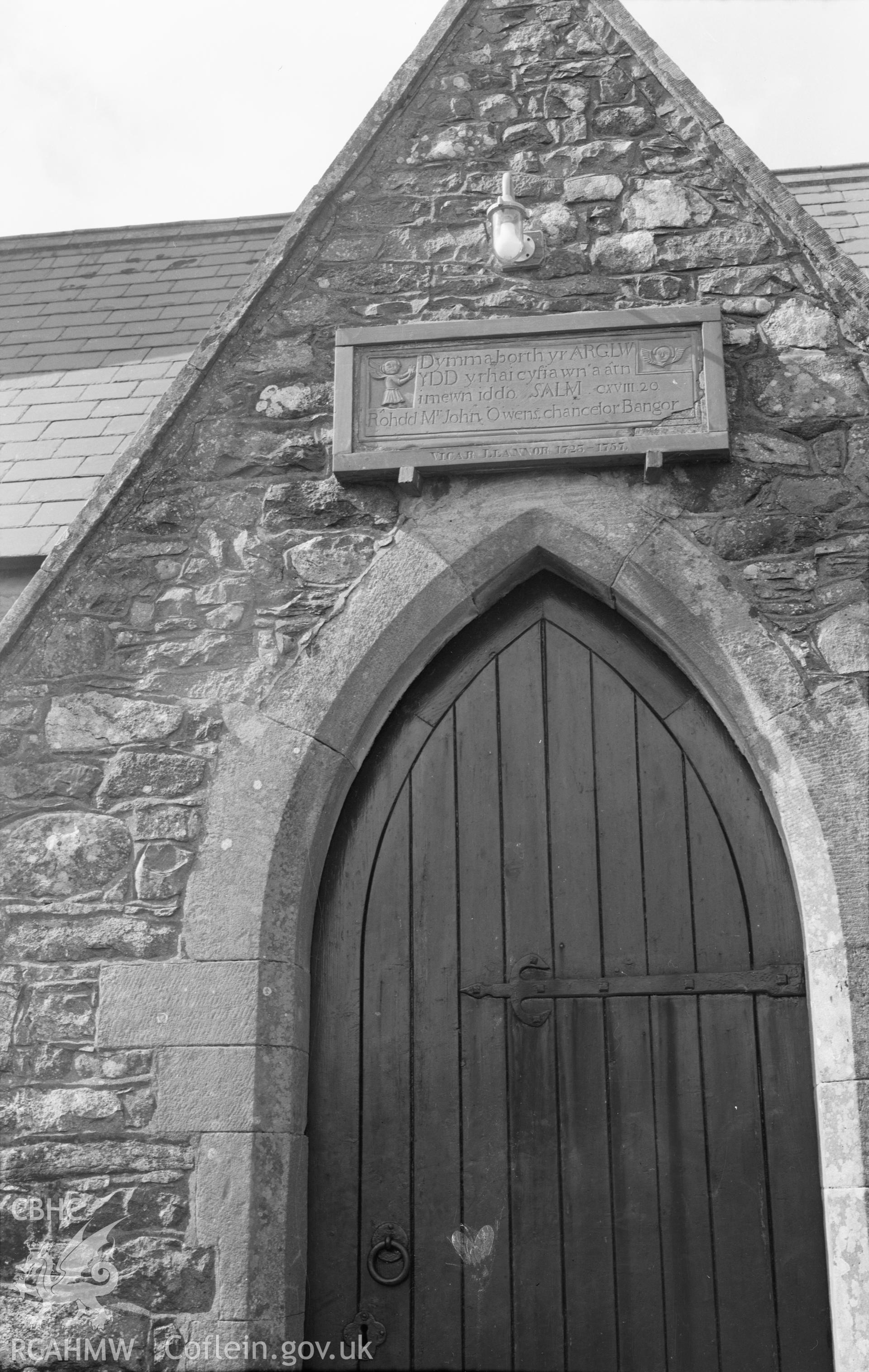 Black and white nitrate negative showing exterior view of Llannor Church.