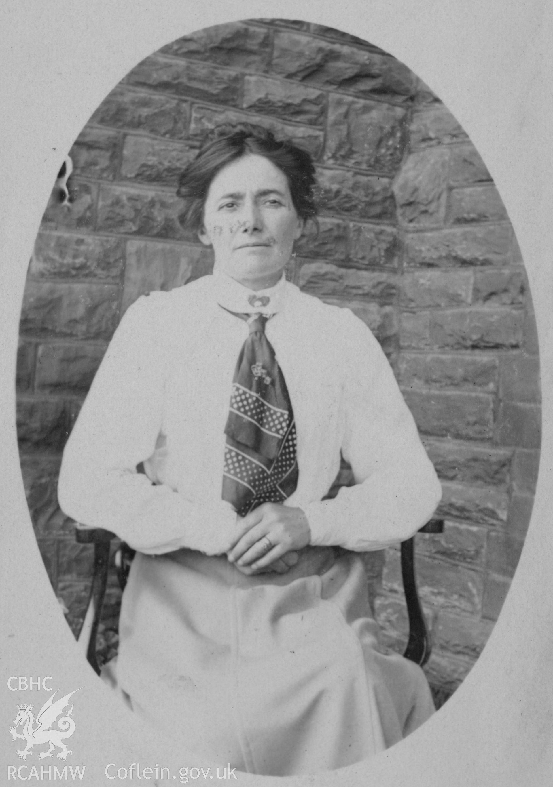 "1911". Photo of a seated adult female. Digitised from a photograph album showing views of Aberystwyth and District, produced by David John Saer, school teacher of Aberystwyth. Loaned for copying by Dr Alan Chamberlain.