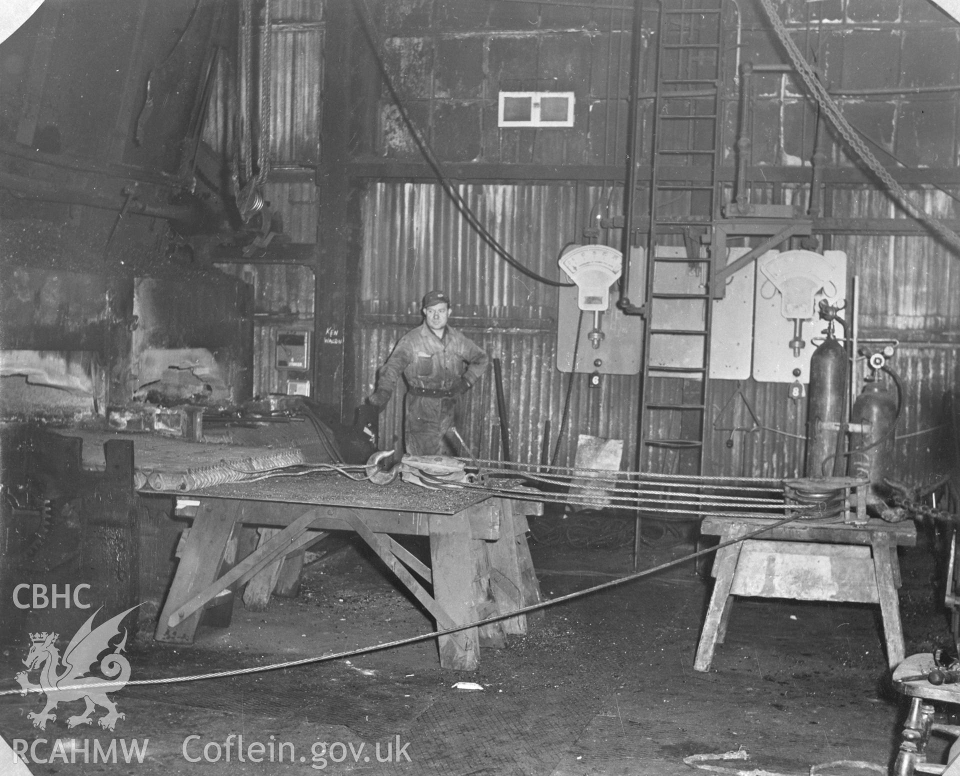 Black and white acetate negative showing working men at an unidentified industrial building in or near Llanelli.