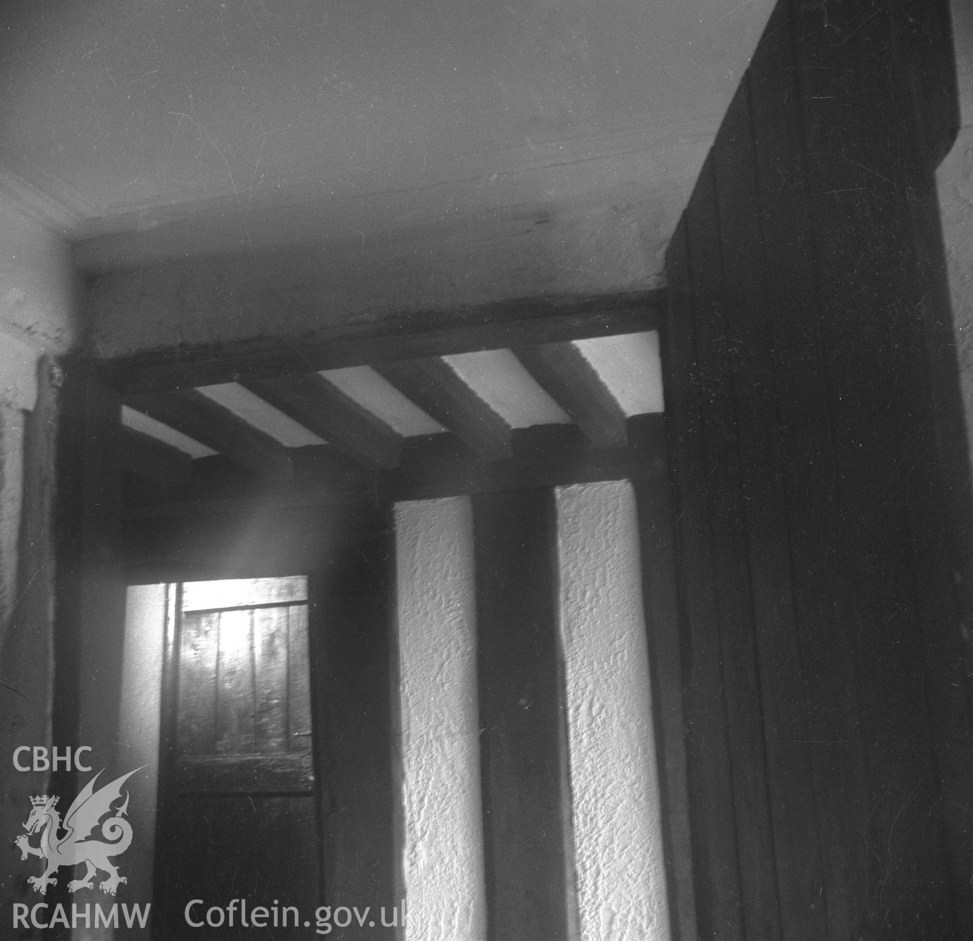 Black and white acetate negative showing interior detail of ceiling joists and doorway, Brithdir-Mawr, Cilcain.