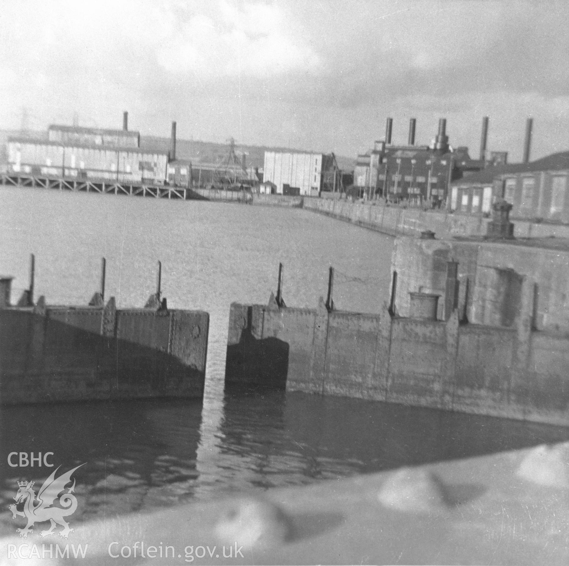 Black and white acetate negative showing view of Llanelli Dock Gates and Power Station.