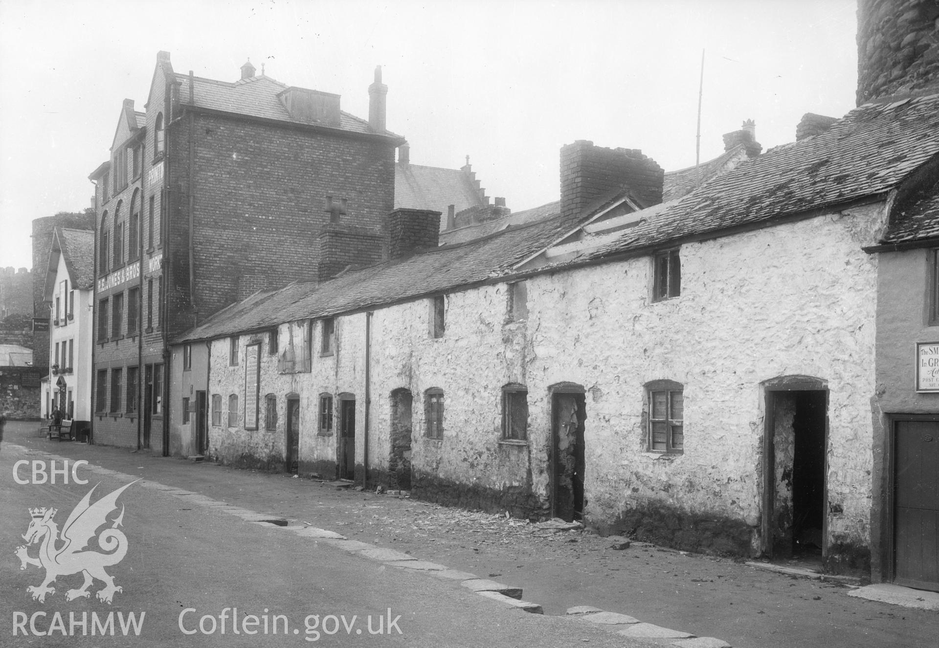 Black and white acetate negative, a copy of a glass plate showing street scene near Plas Mawr, Conwy.