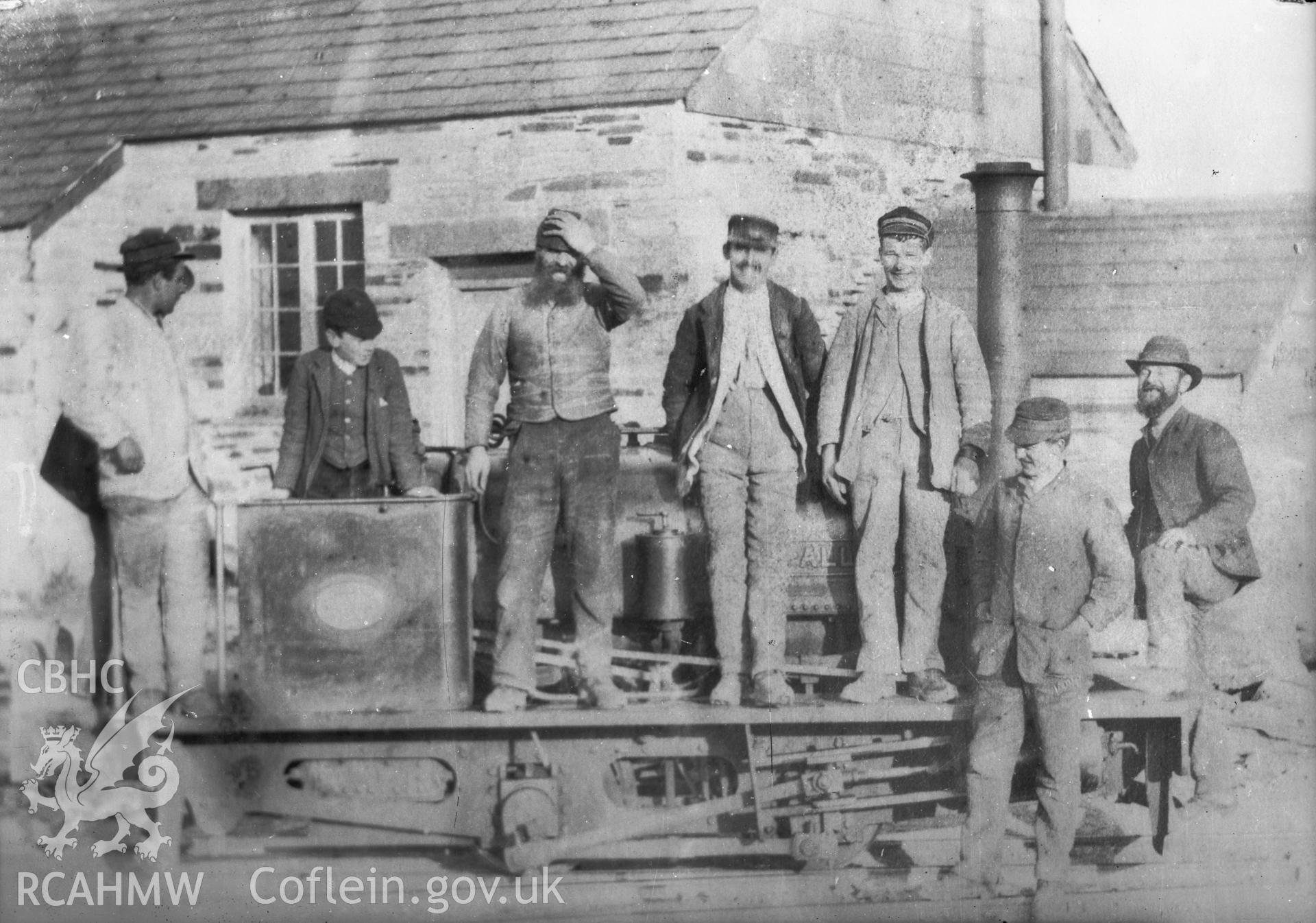 Black and white acetate negative, a copy of a glass plate showing steam train and group of people,
