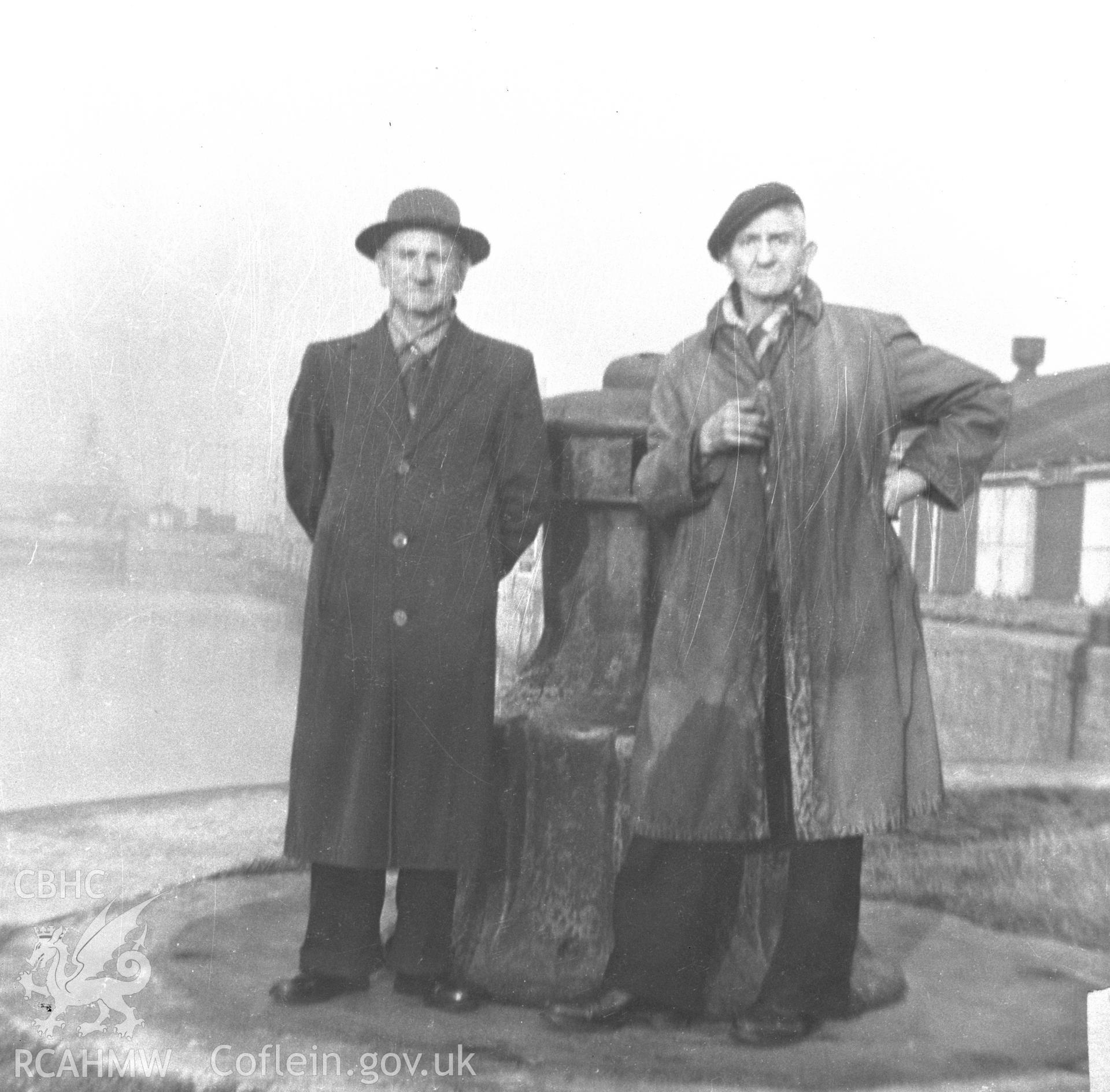 Black and white acetate negative showing two figures in Llanelli Docks.