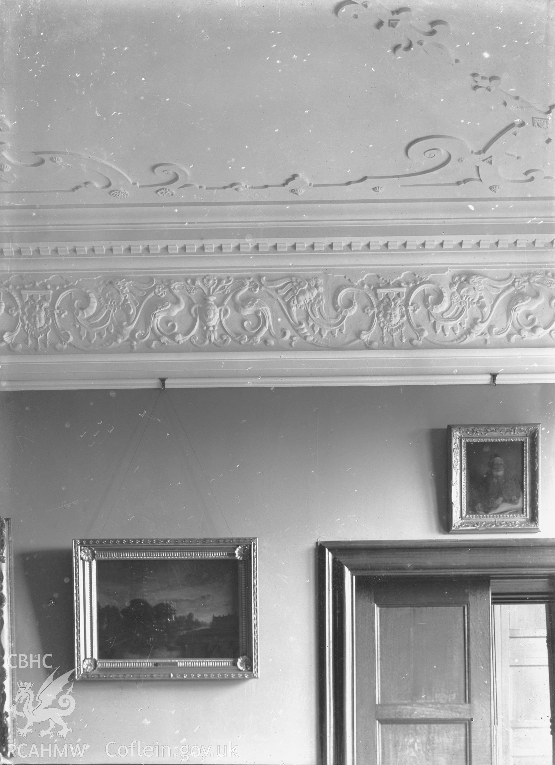 Black and white glass negative showing decorative plasterwork on the ceiling of unidentified house.