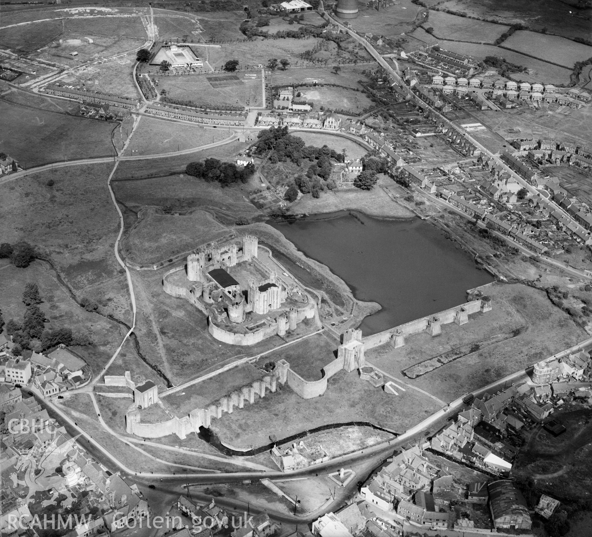 View of Caerphilly showing castle and open-air swimming pool, Oblique aerial photograph, 5?" cut roll film.