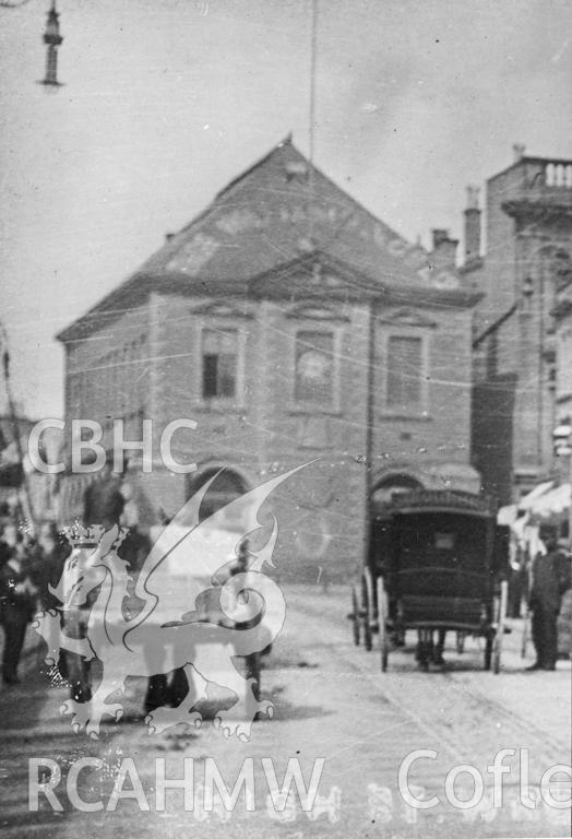 Early image of Wrexham Old Town Hall, with horse and cart and carriages in the foreground.
