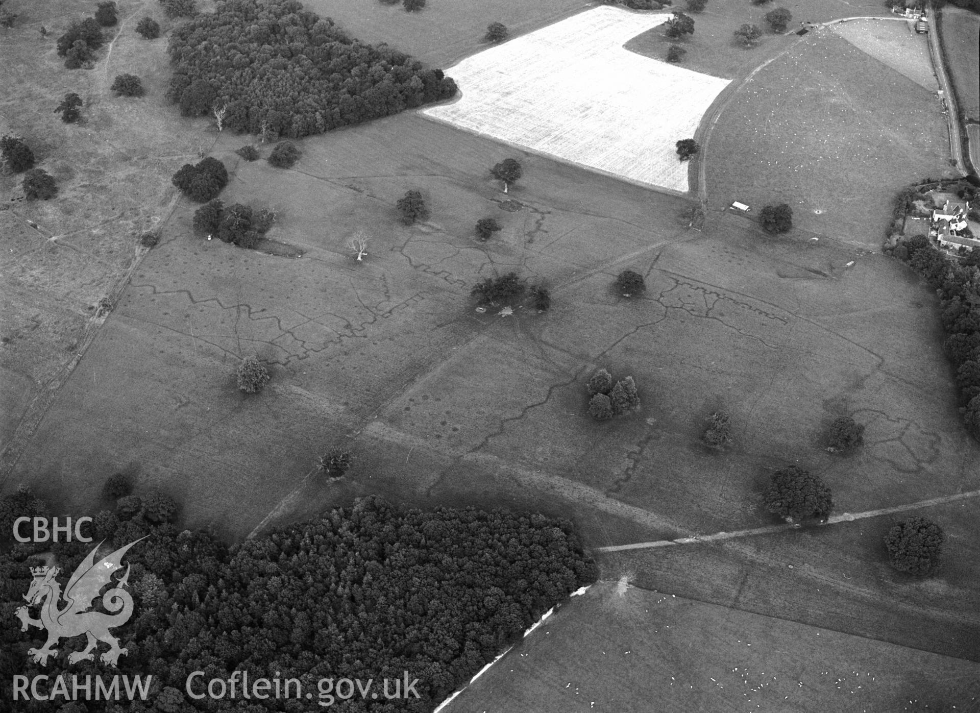 RCAHMW black and white oblique aerial photograph of Bodelwyddan Park Army Practice Trenches, taken by C R Musson, 22/07/1996.