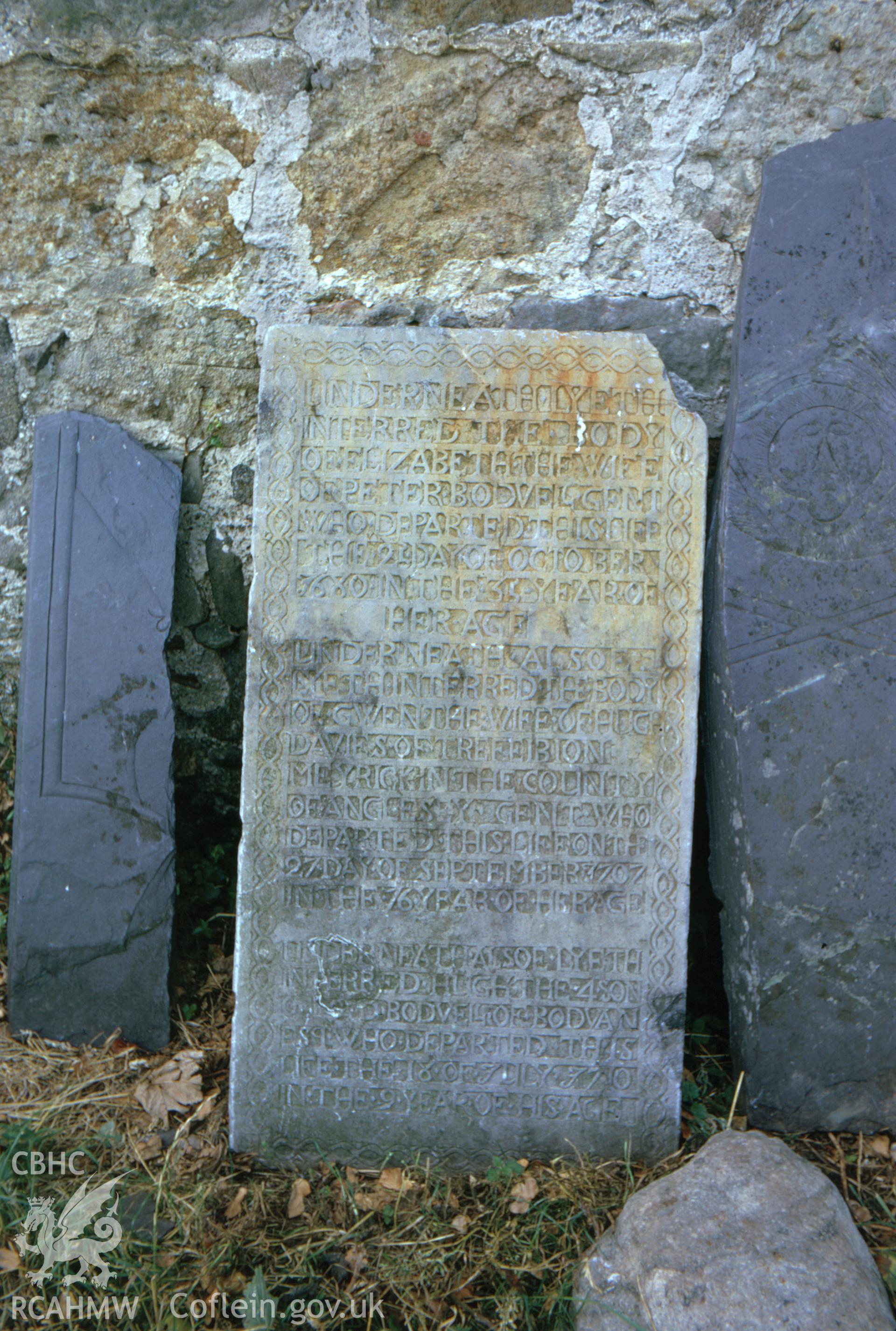 Colour slide showing inscribed memorial stone at Llanfaglan Church.