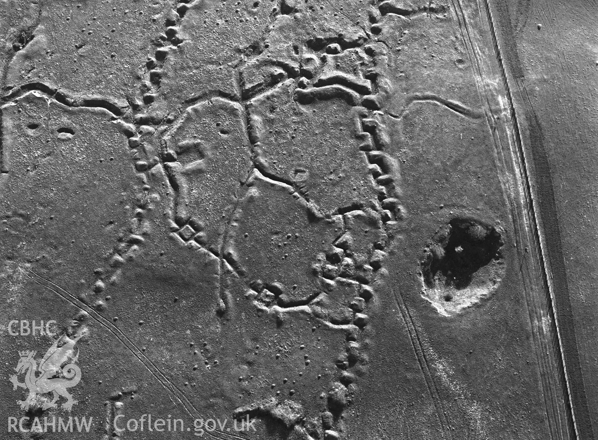 RCAHMW black and white oblique aerial photograph of Penally WWI practice trench system. Taken by C R Musson on 13/04/1995
