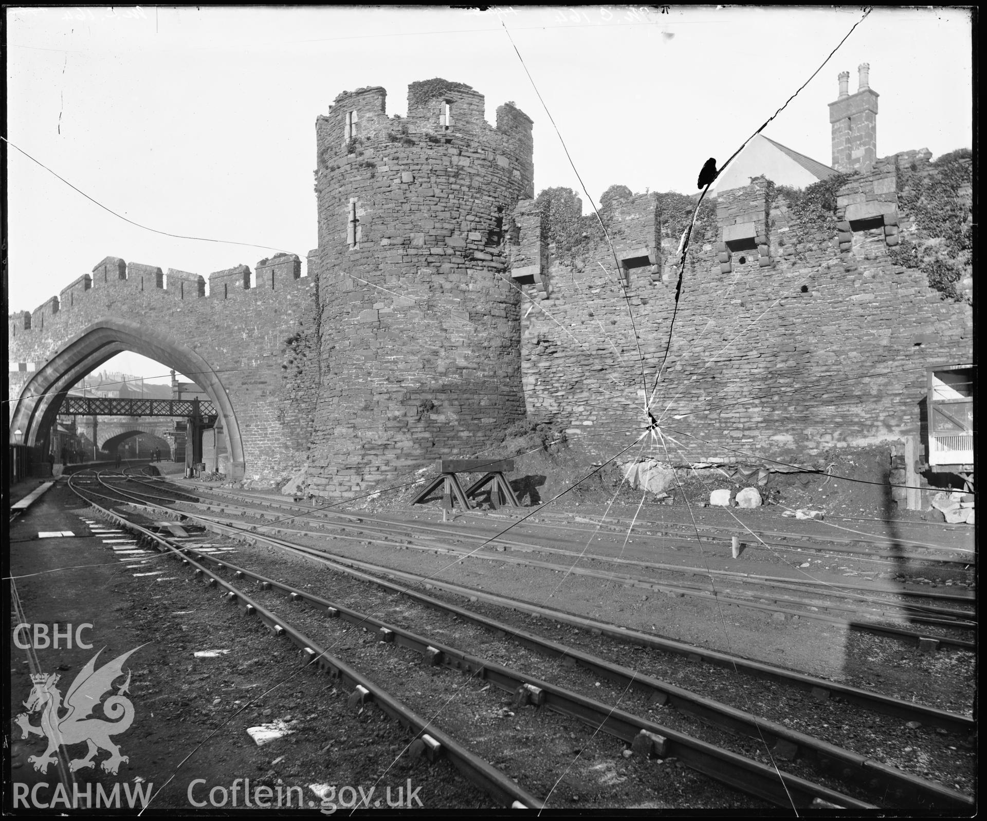 B&W photo of Conway Castle. External view showing railway tracks. Negative held