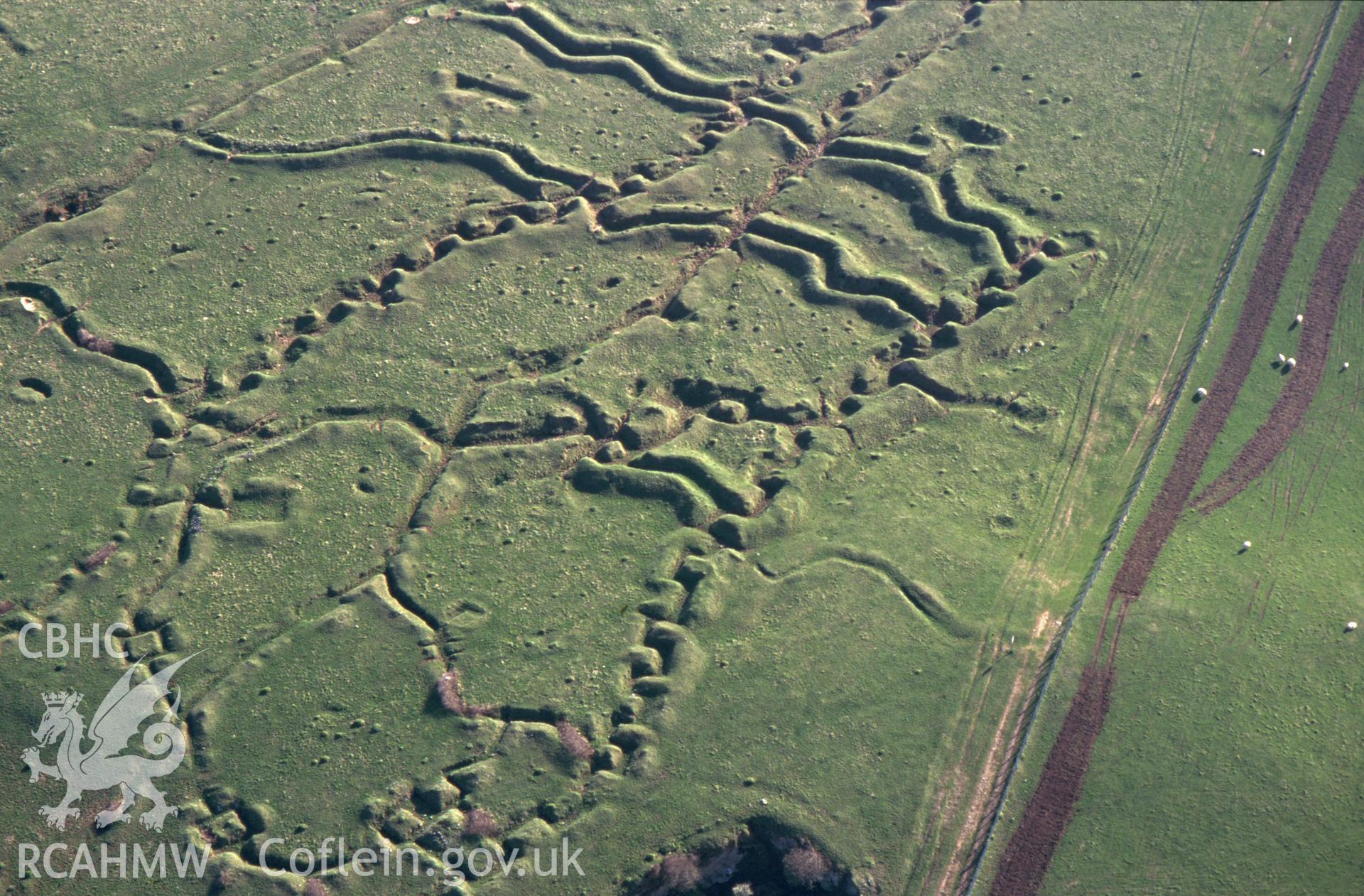 RCAHMW colour oblique aerial photograph of Penally WWI practice trench system. Taken by C R Musson on 13/04/1995