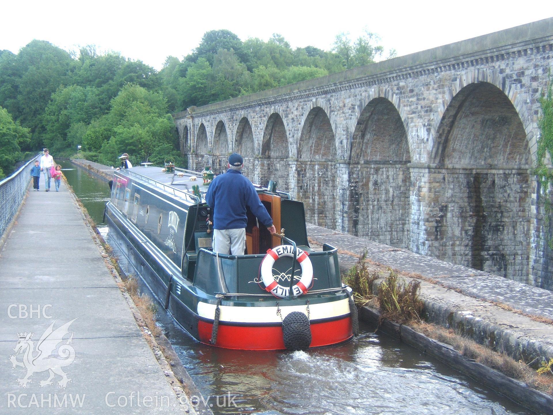 North-east elevation of viaduct looking south from aqueduct deck with boat.