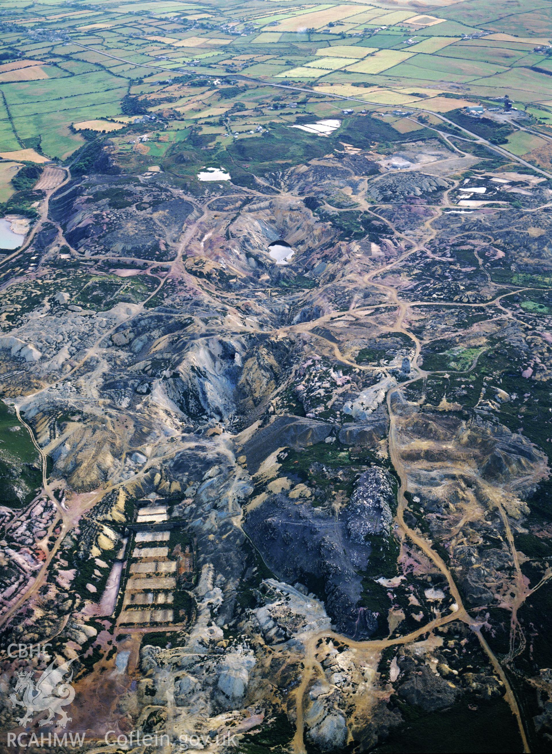 RCAHMW black and white oblique aerial photograph of Parys Mountain Copper Mines, Amlwch, taken by C R Musson, 1996.