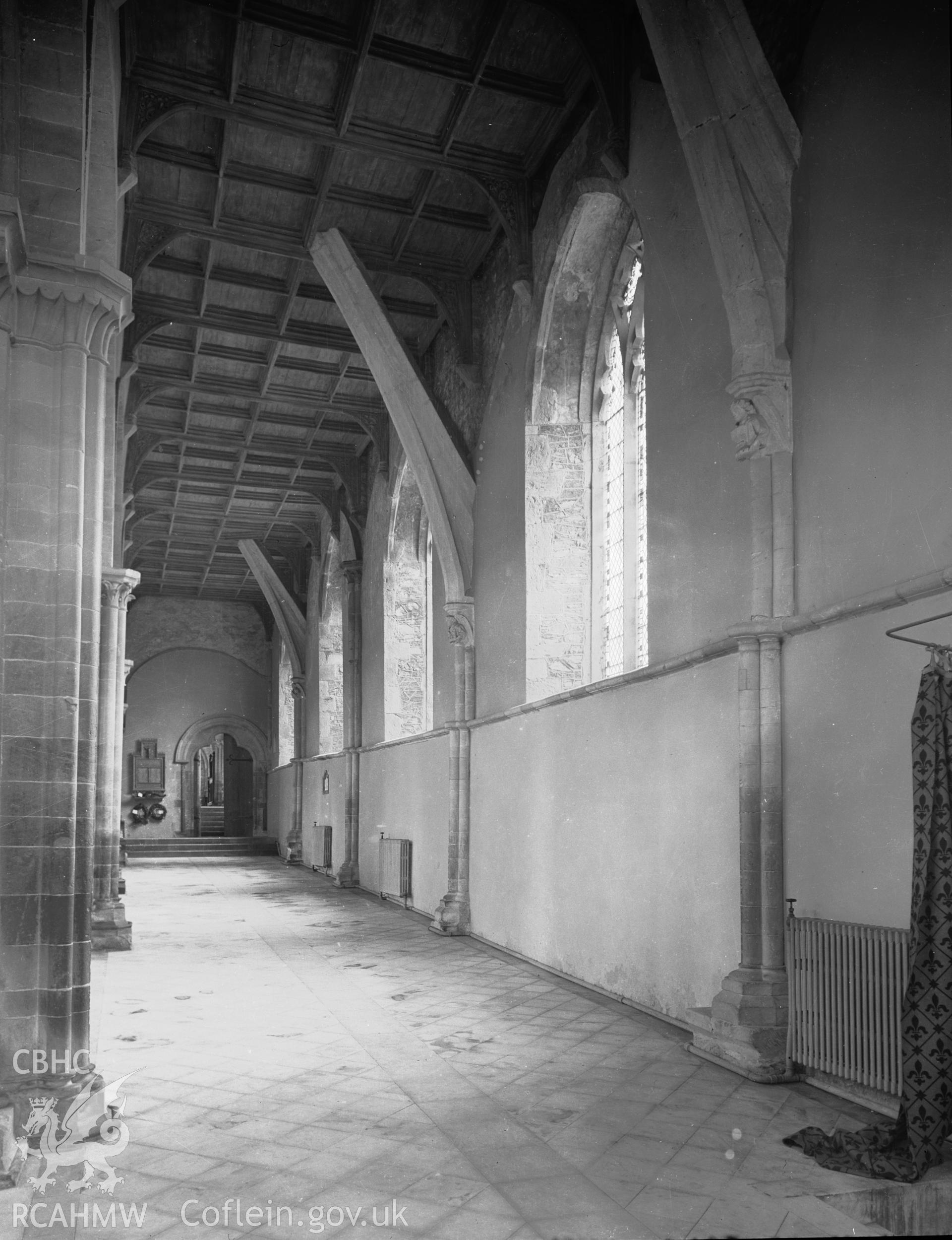 Interior view showing north aisle of nave, looking east.