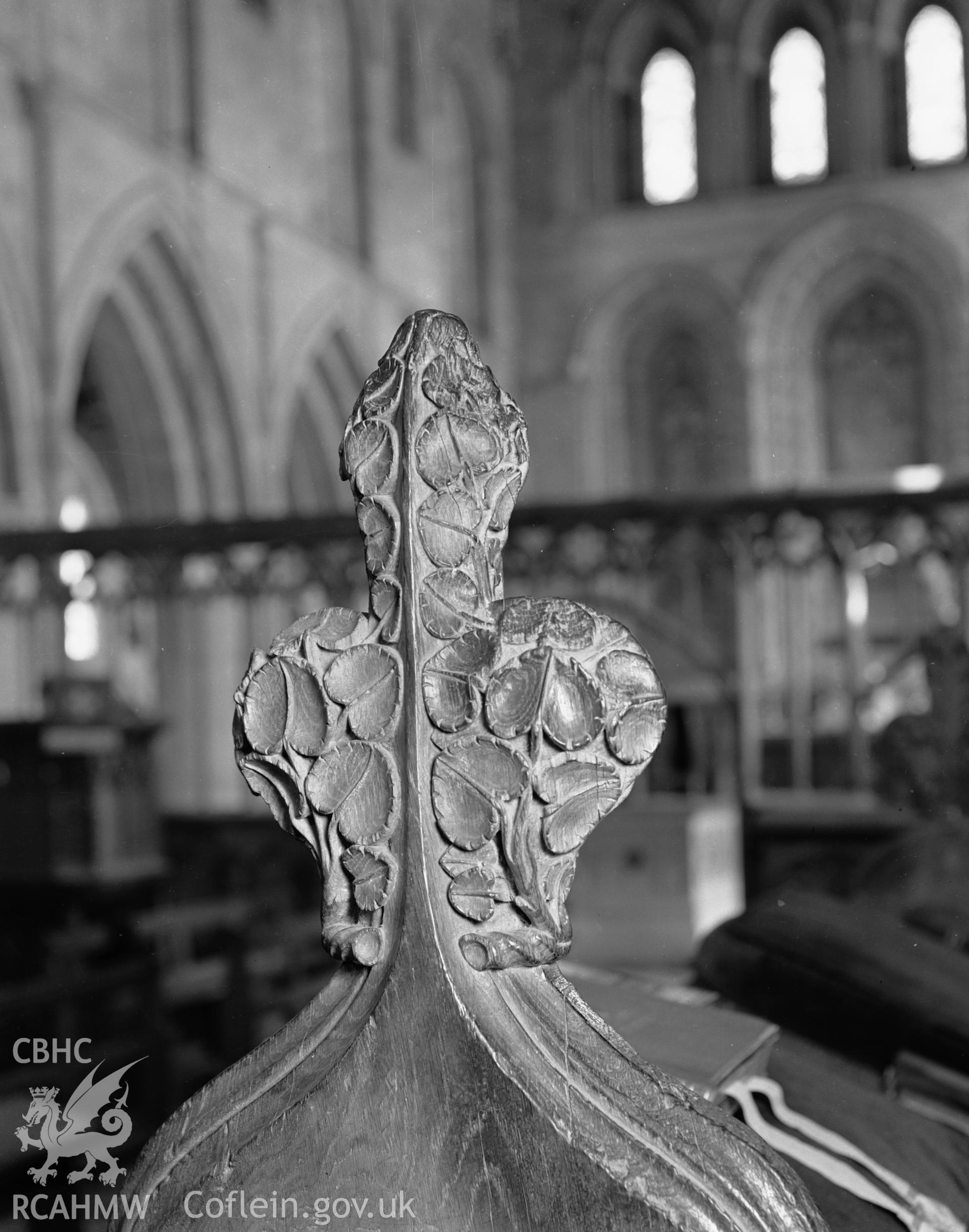 Interior view showing desk end on choir stalls on south side..