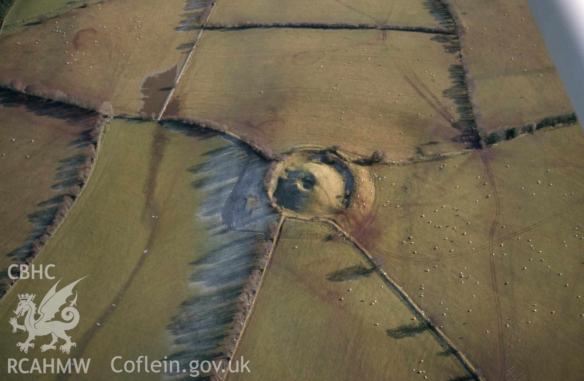 Slide of RCAHMW colour oblique aerial photograph of Cwm Camlais, Motte; Castle Mound, Cwm Camlais, taken by T.G. Driver, 2/1/2001.