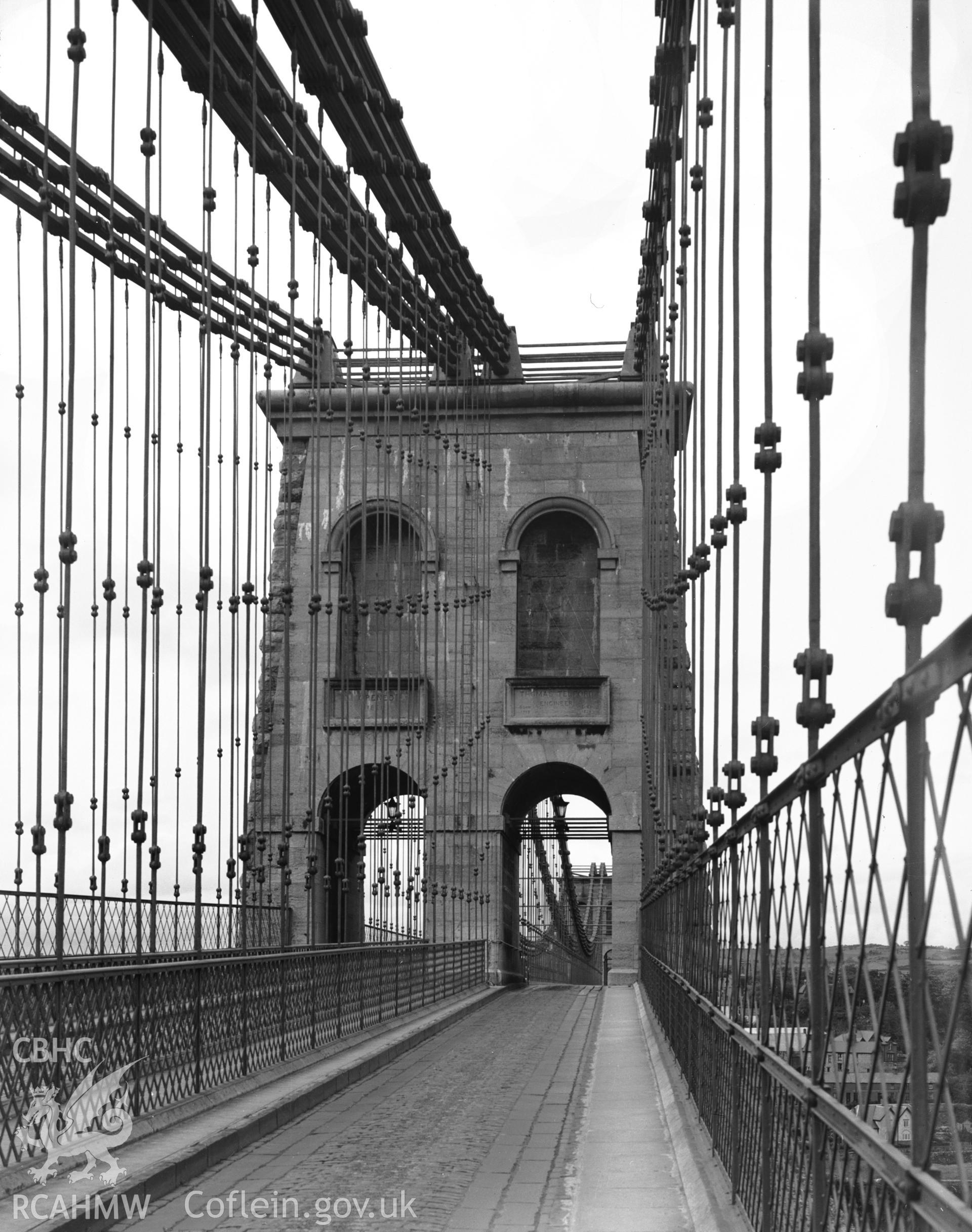 Digitised copy of a black and white negative showing Menai Suspension Bridge produced by RCAHMW, pre1960.