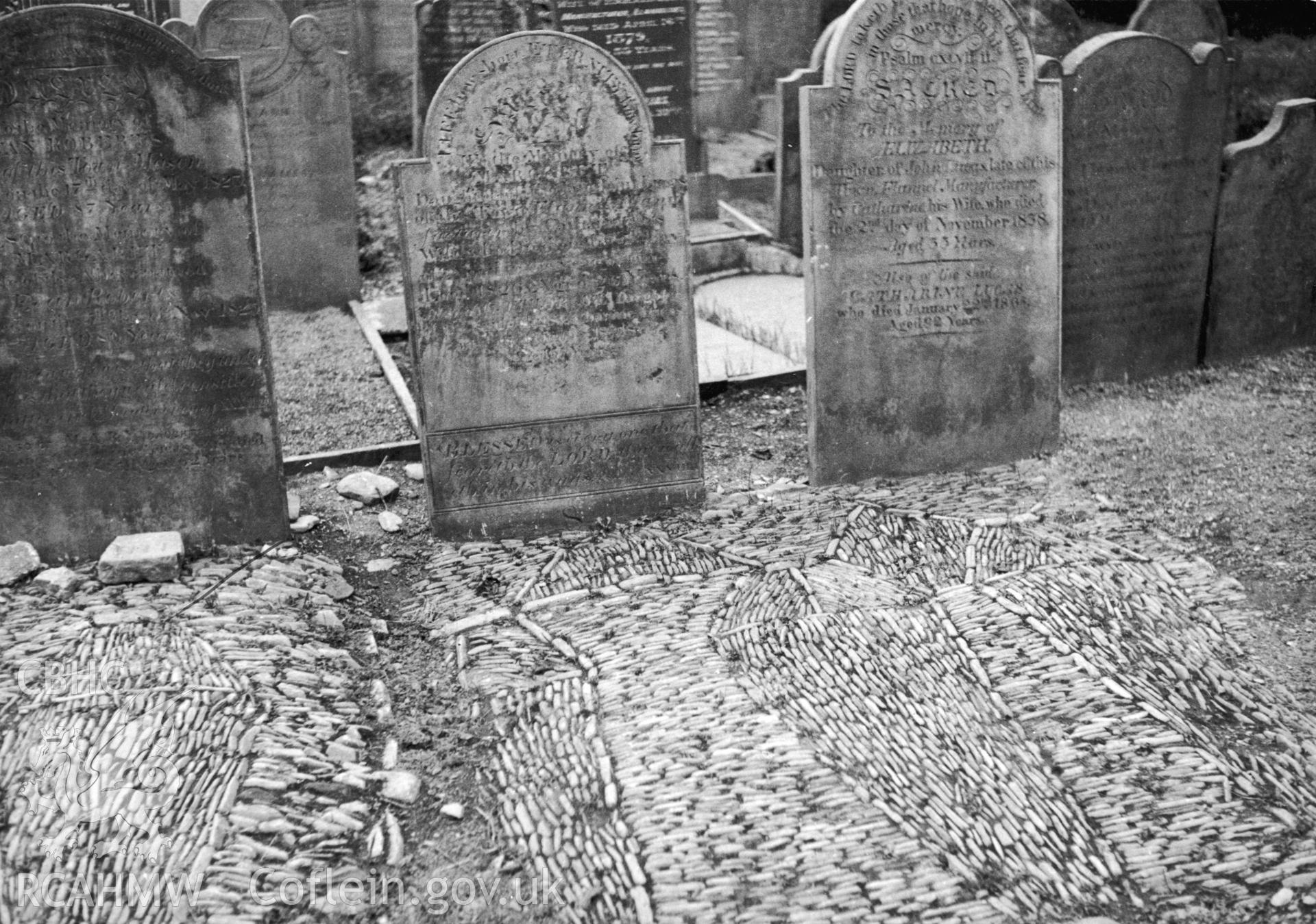 Cobbled graves in churchyard.