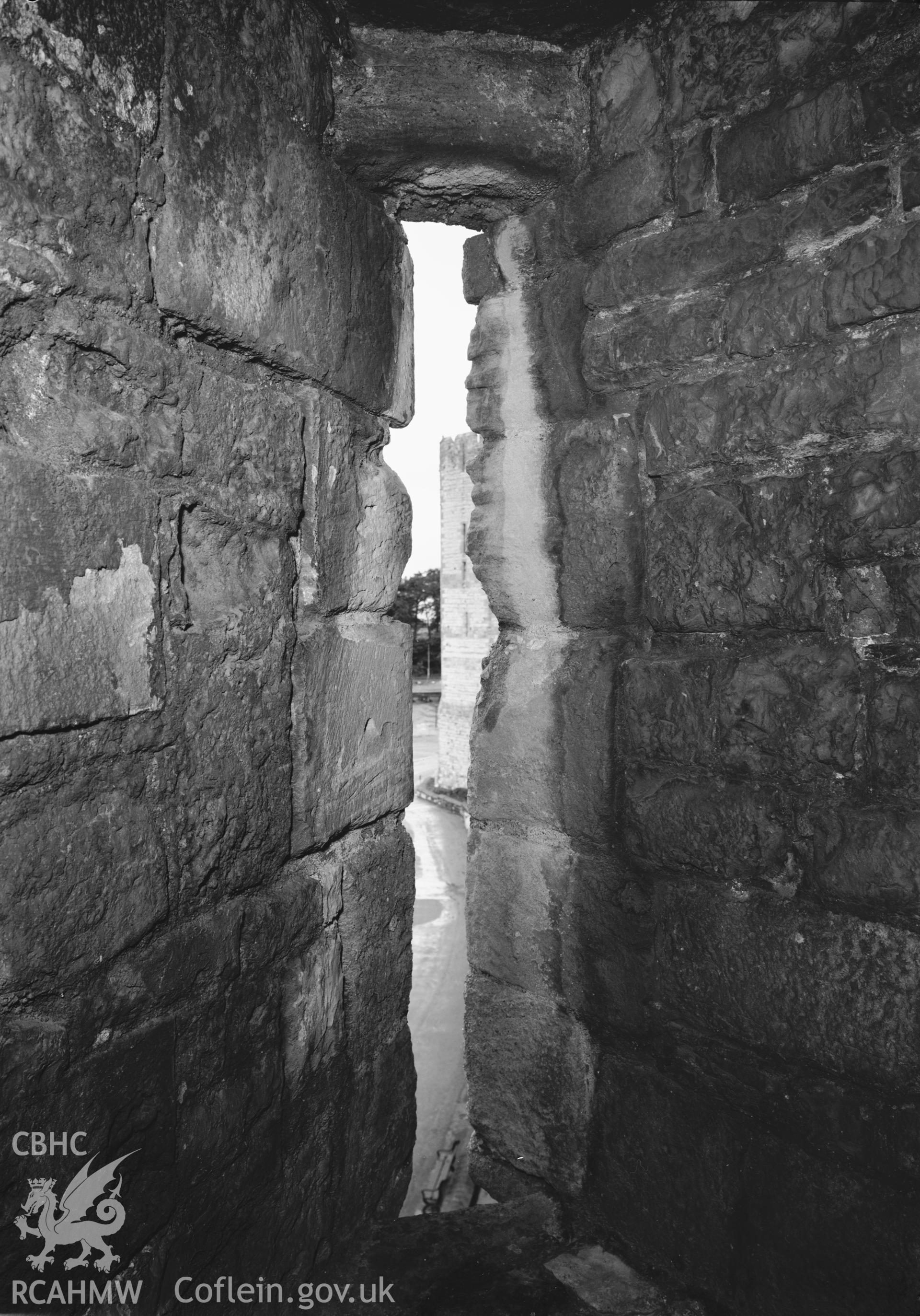 D.O.E photograph of Caernarfon Castle - Queen's Tower through arrow loop of Chamberlain Tower.