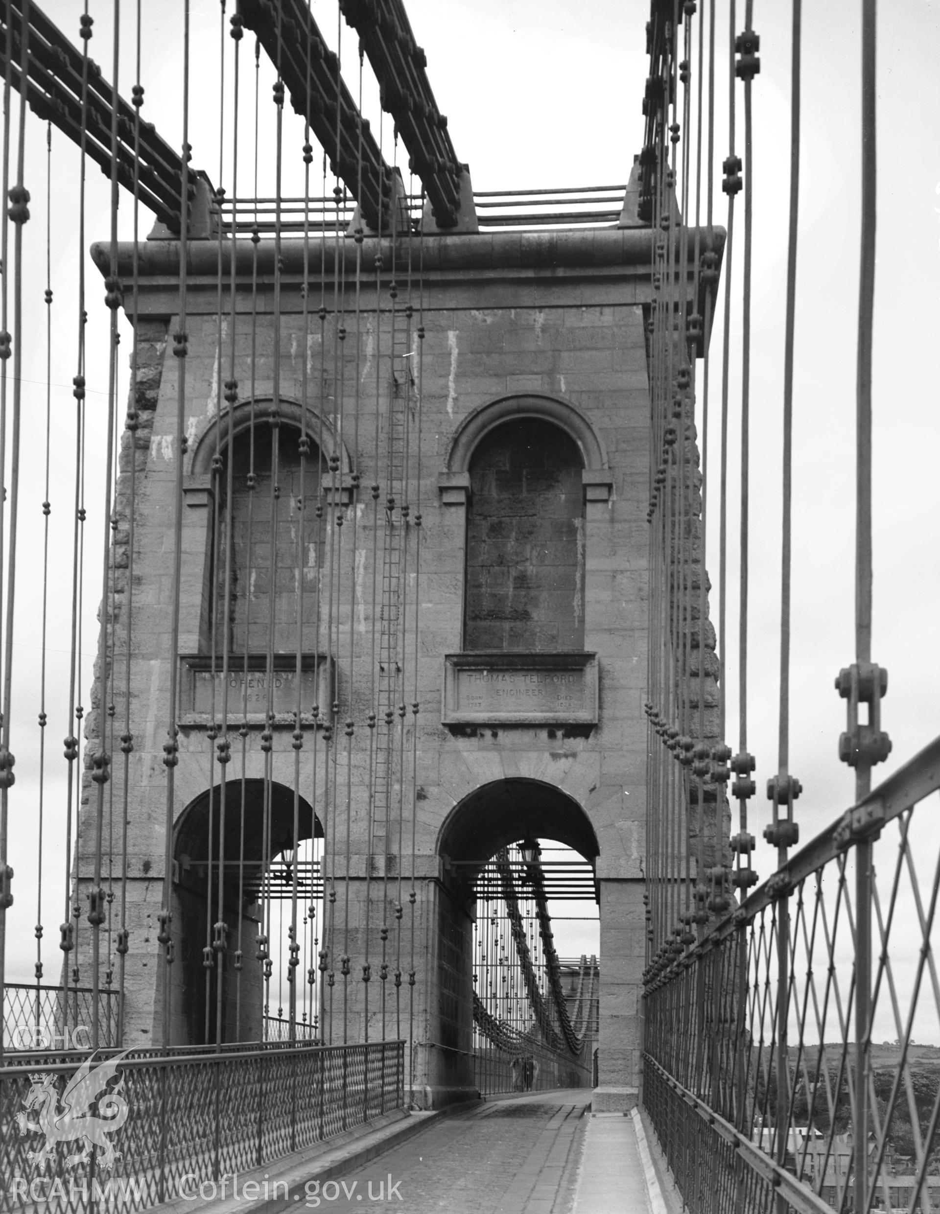 Digitised copy of a black and white negative showing Menai Suspension Bridge produced by RCAHMW, pre1960.