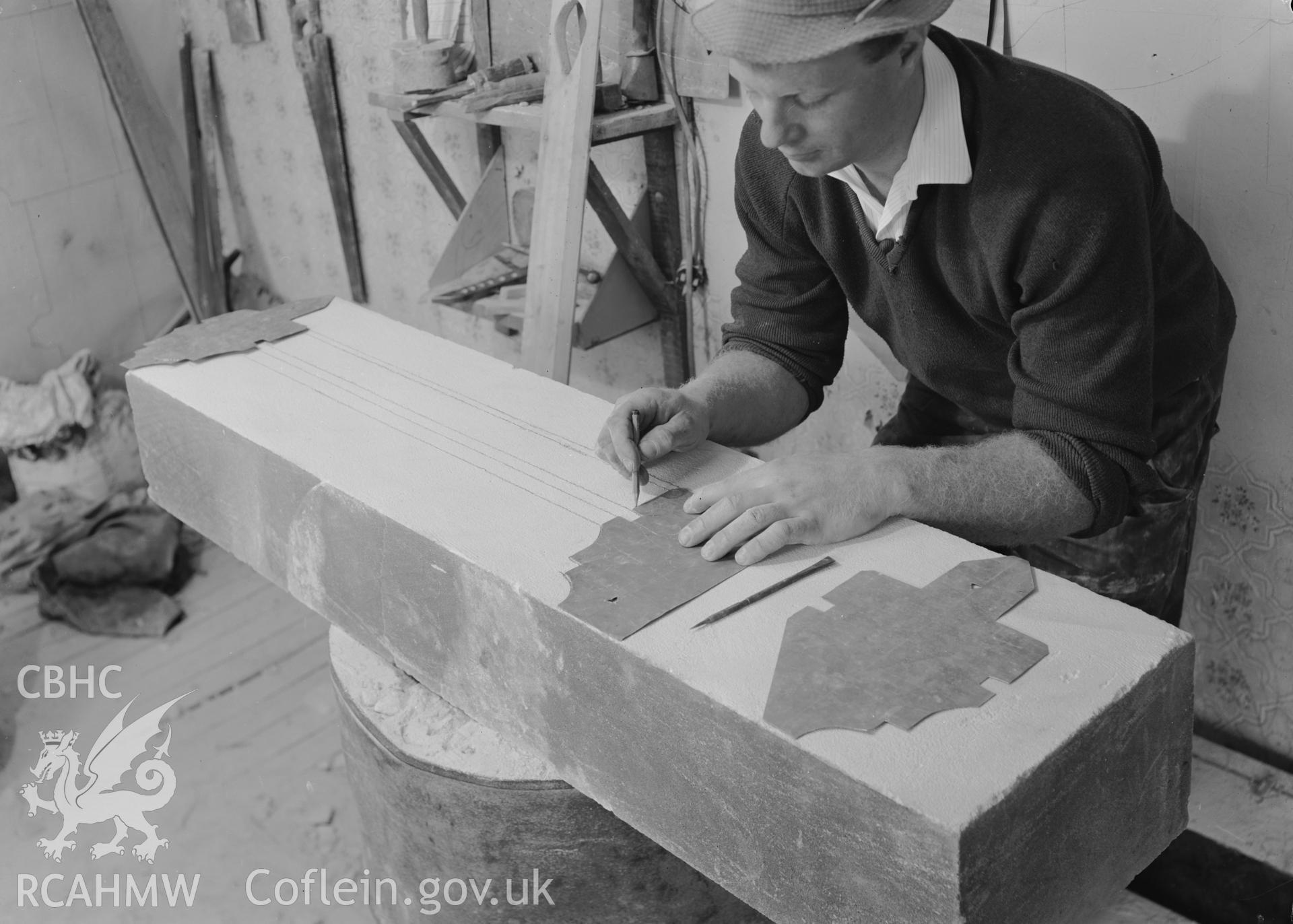 D.O.E photographs of Caerphilly Castle - view of restorer setting out mouldings on transome.