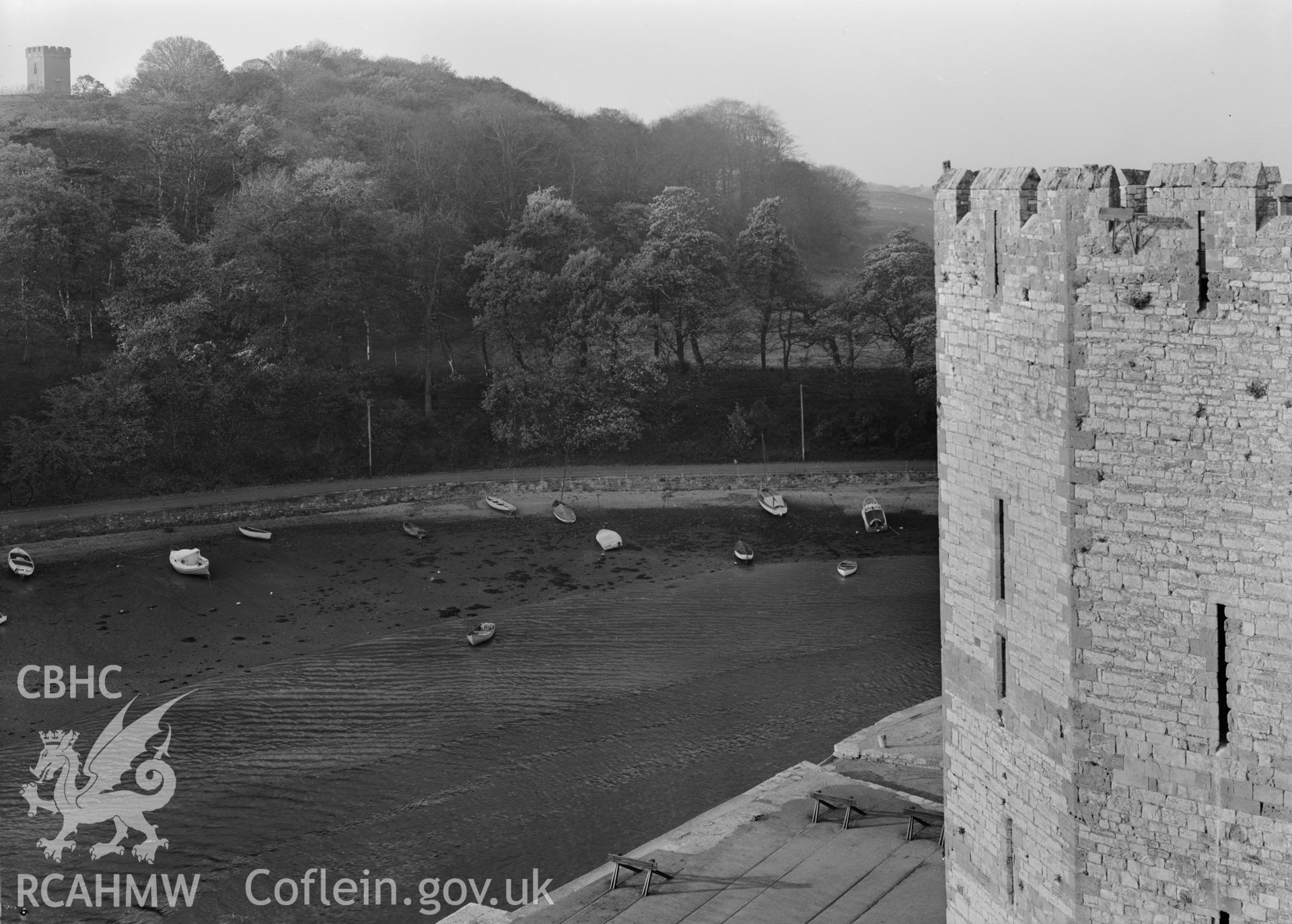 D.O.E photograph of Caernarfon Castle - view across the river Seiont from the walls of the Castle. .