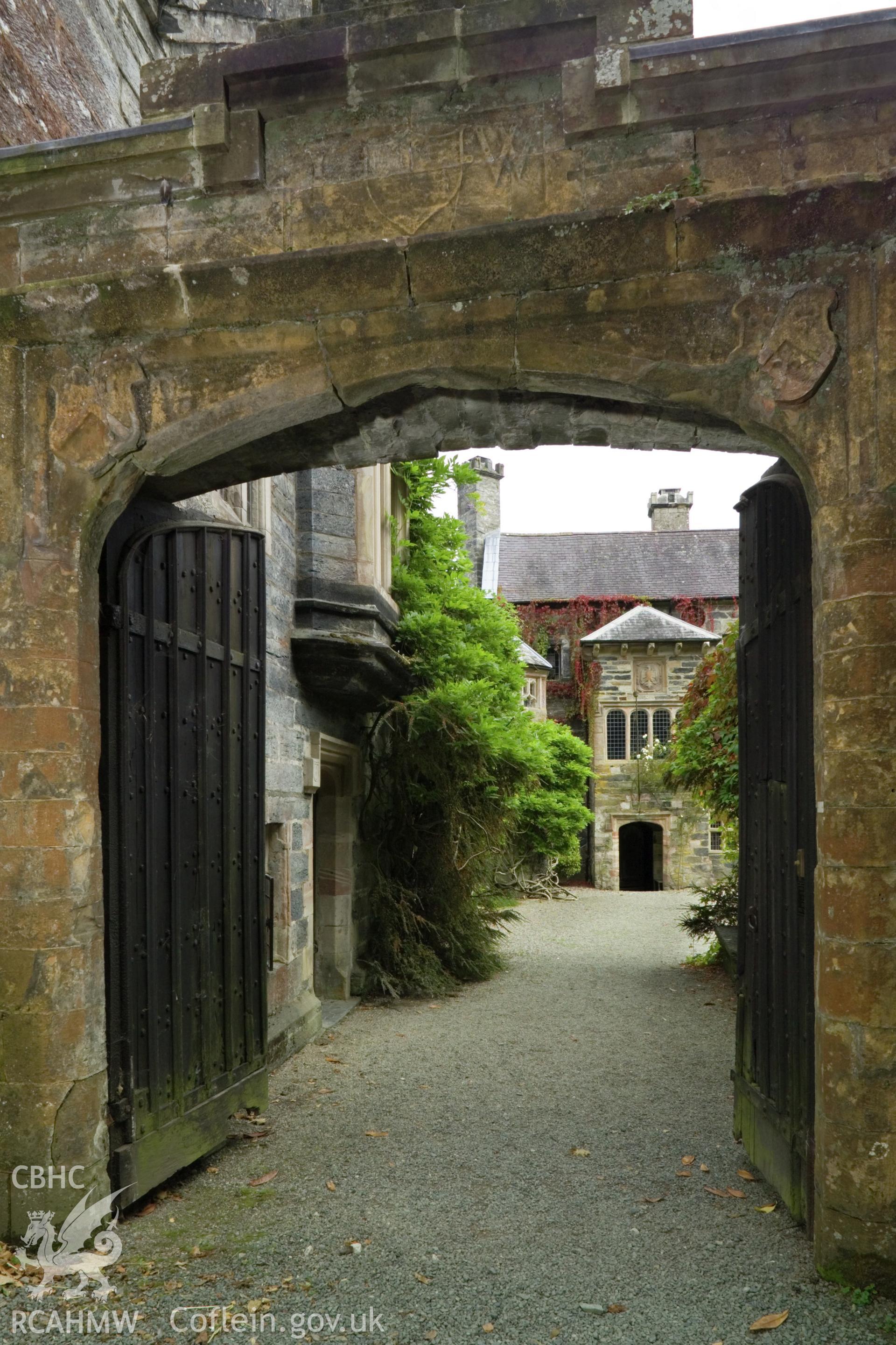 House viewed through entrance gate from the southwest.
