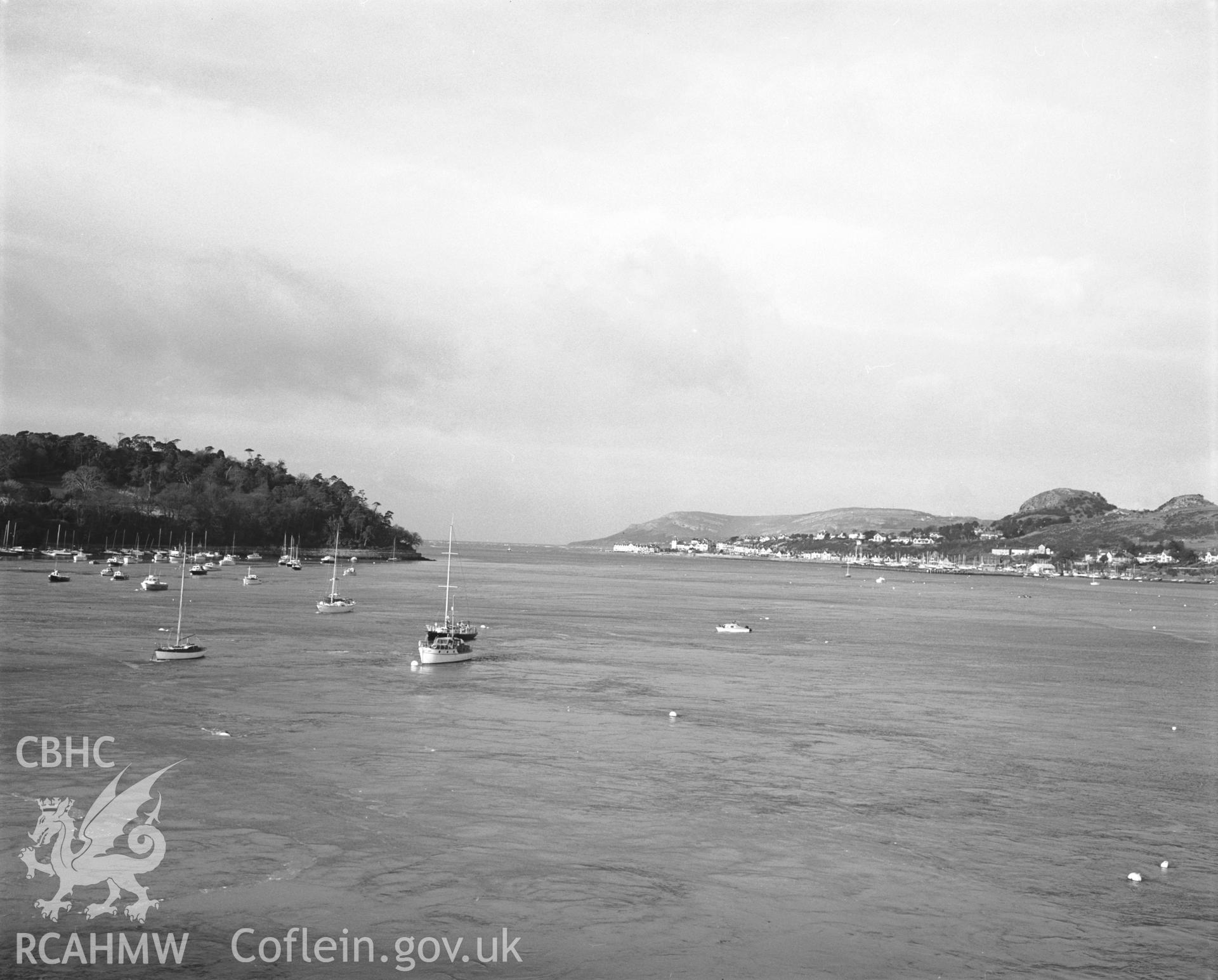 Photographic negative showing distant view of Conwy and surrounding hills from the sea; collated by the former Central Office of Information.