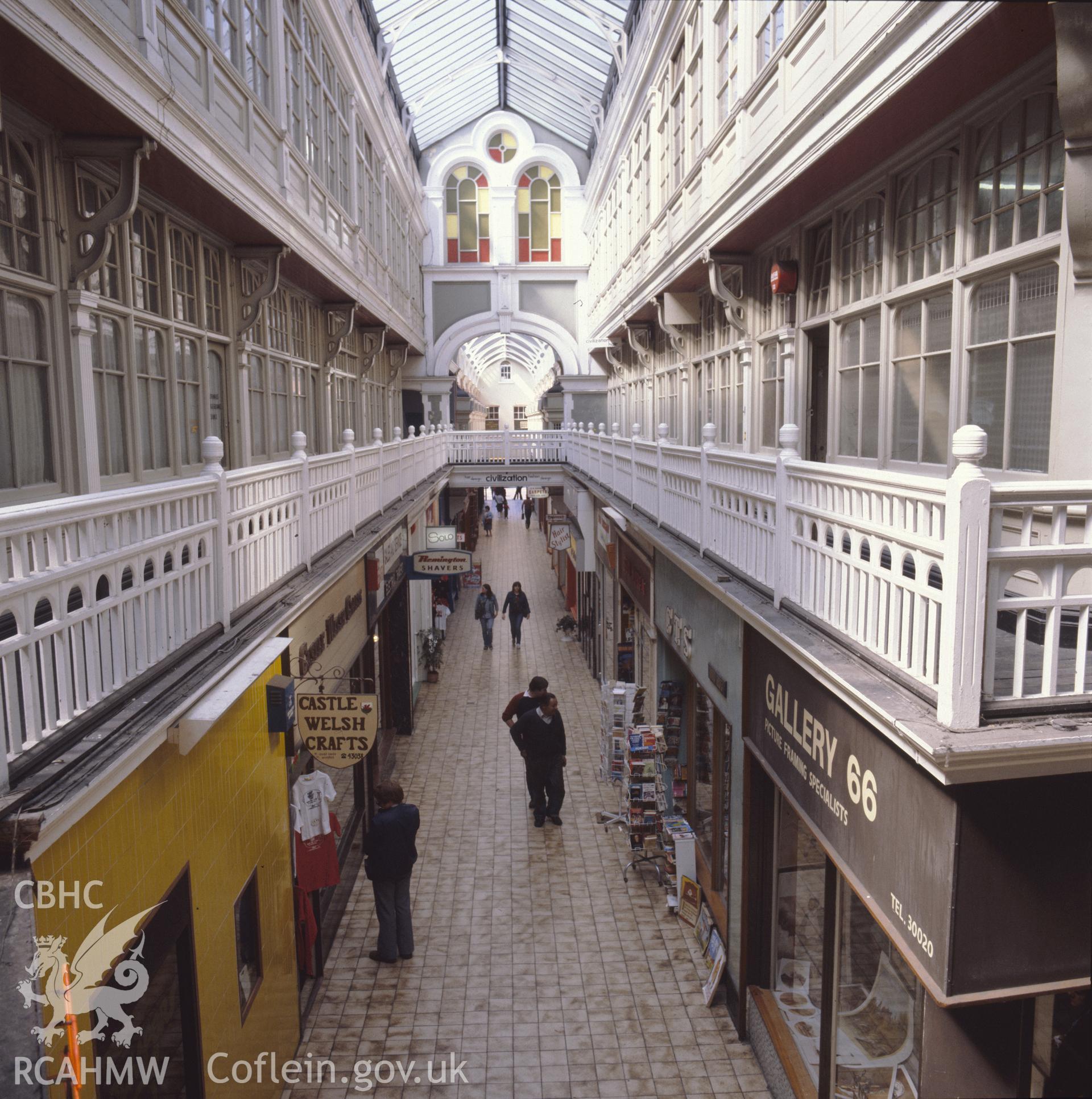 1 colour transparency showing view of Castle Arcade in Cardiff with shoppers; collated by the former Central Office of Information.