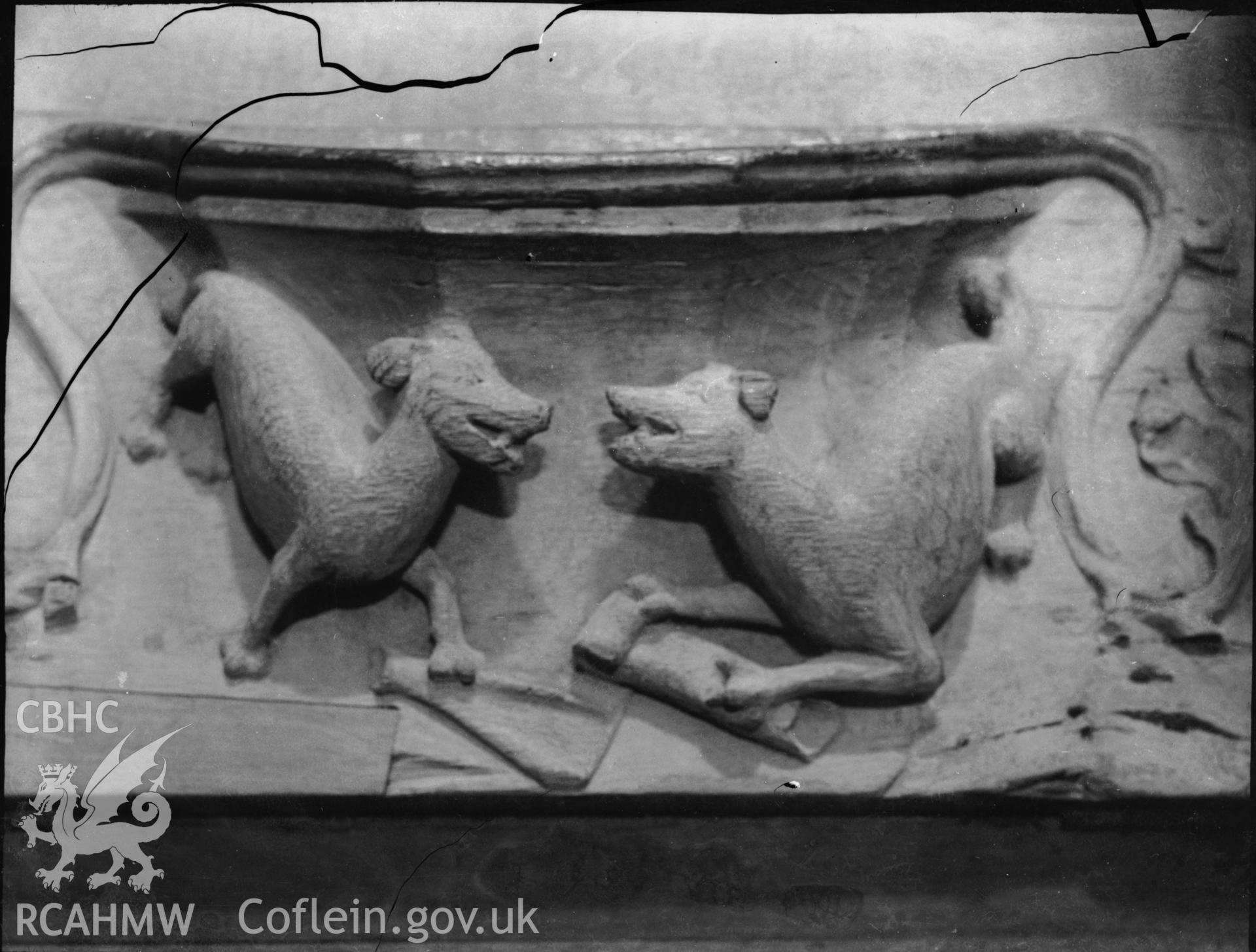 Black and white photo showing carved relief featuring dogs, in St Davids Cathedral.
(they are sometimes referred to as two wolves fighting over bones of an unknown victim, whilst others think it looks like a psalter or hymn book that they have torn up. Info from St David's Cathedral Library twitter account, 26 August 2022)