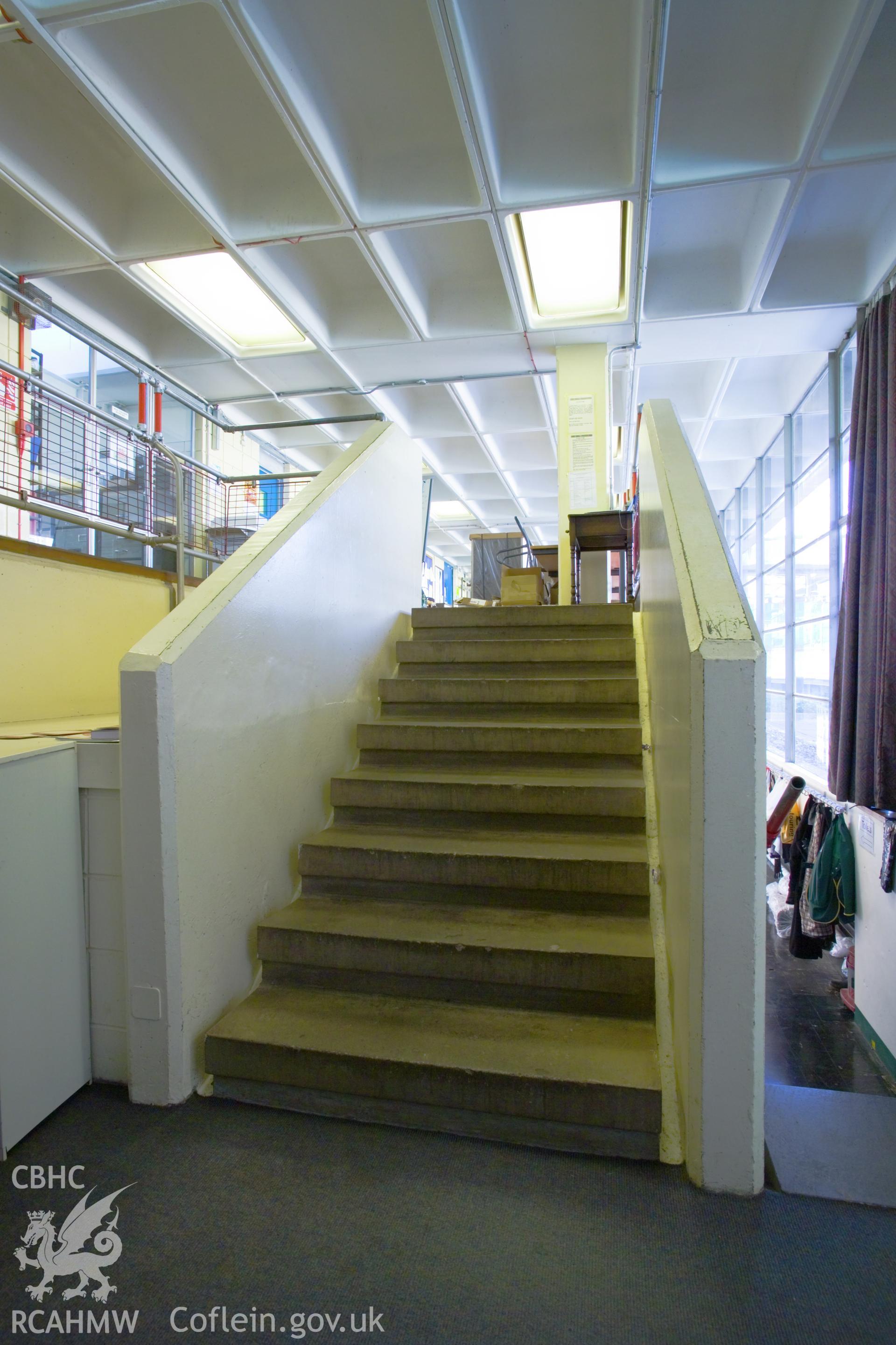 Steps from staff room to circulation/photocopier corridor