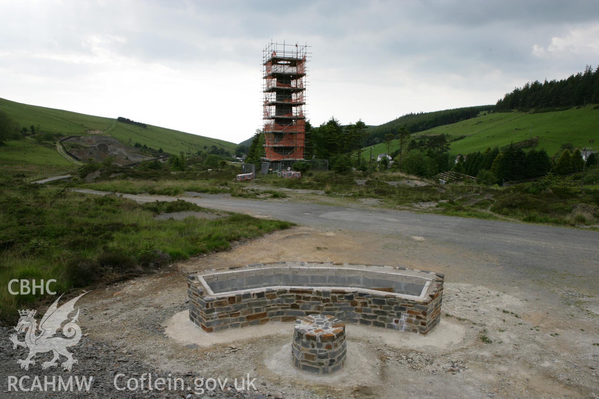 Cwmsymlog chimney stack under scaffolding, view from east with new interpretation sign under construction.