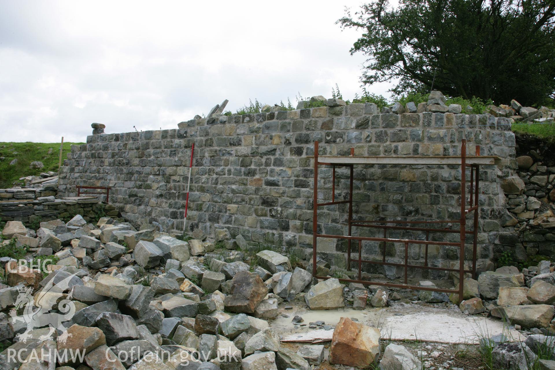 View of fort wall section reconstruction, in progress, to north-east of motte