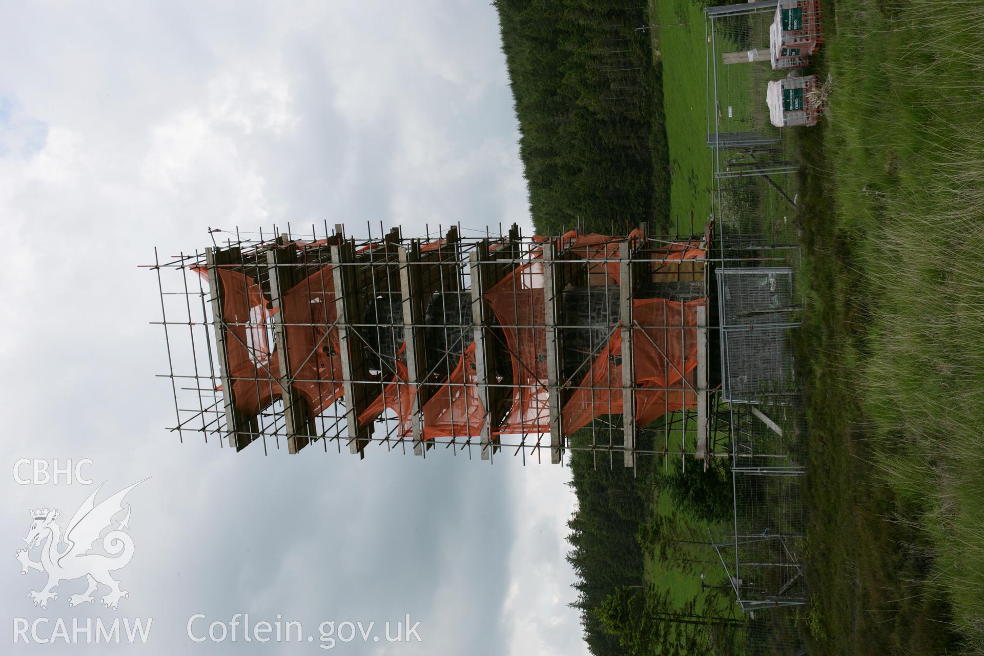 Cwmsymlog chimney stack under scaffolding, view from south-east.