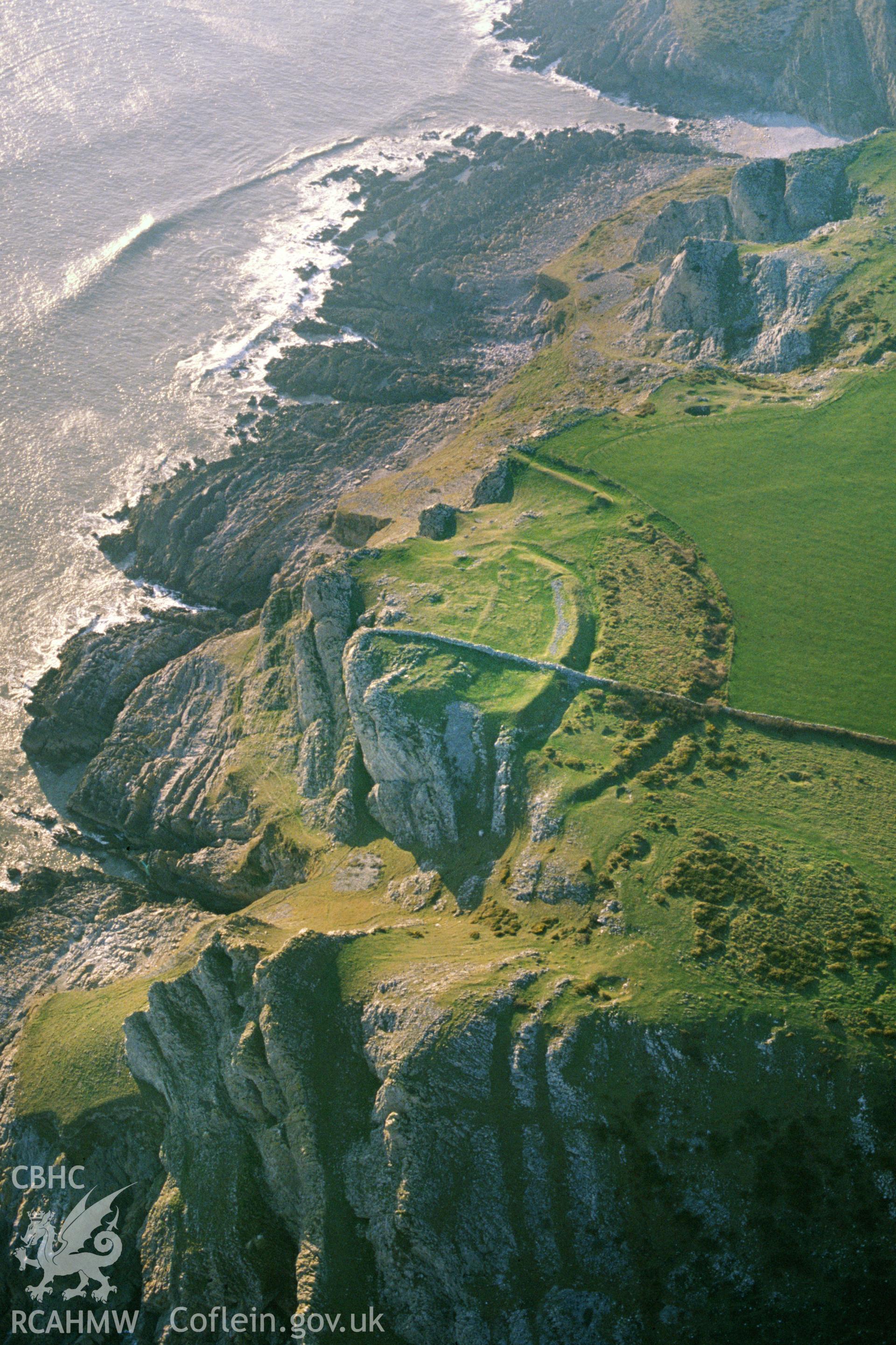 Slide of RCAHMW colour oblique aerial photograph of Deborah's Hole Camp; The Knave Promontory Fort, taken by C.R. Musson, 25/3/1991.