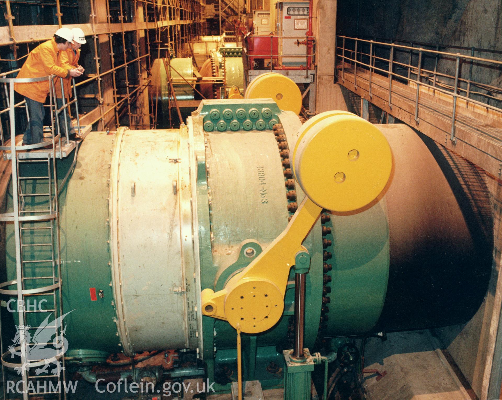 1 colour print showing view along the outlet valve gallery at Dinorwig Power Station; collated by the former Central Office of Information.