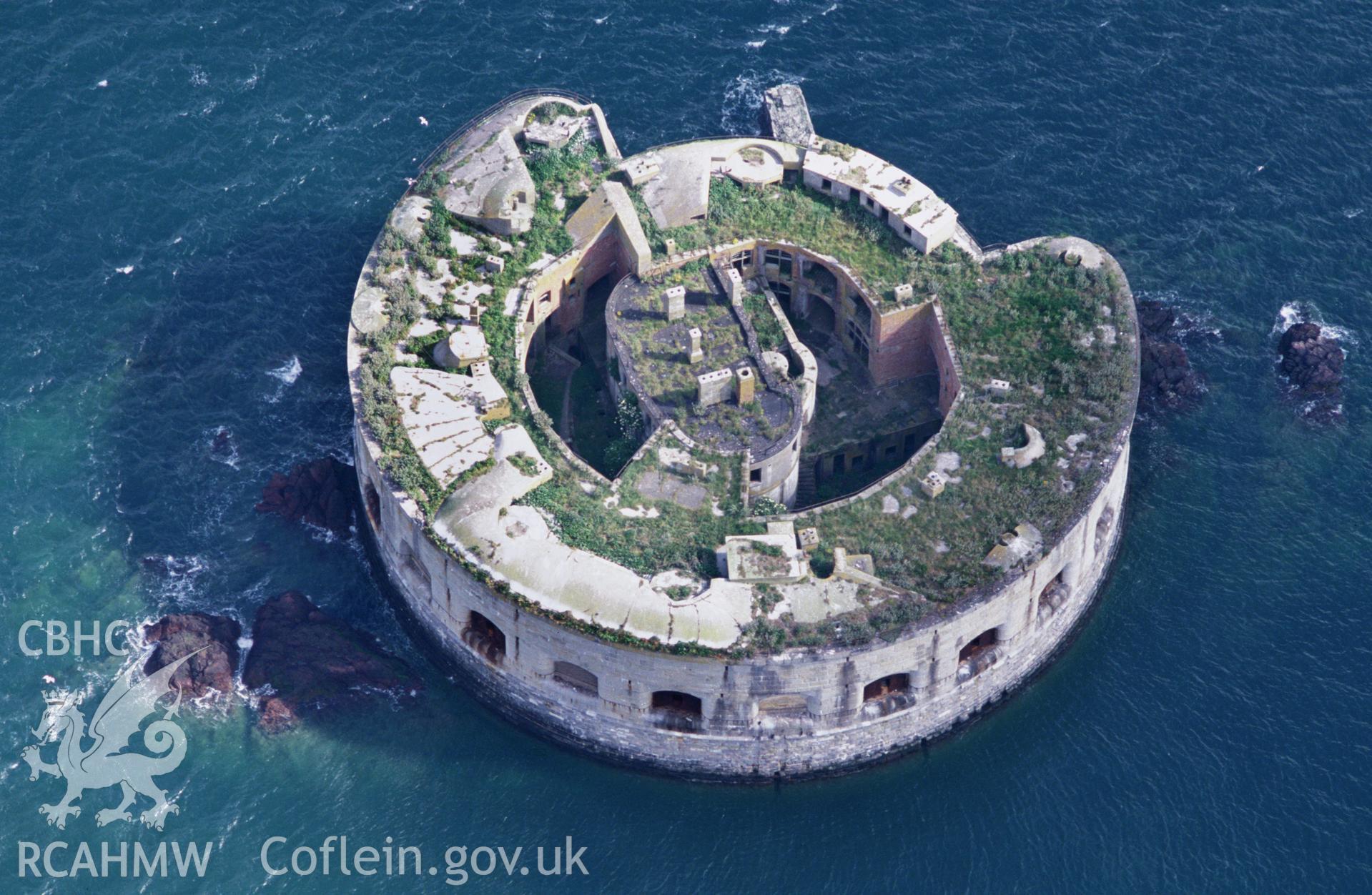 RCAHMW colour oblique aerial photograph of Stack Rock Fort, detailed view. Taken by Toby Driver on 28/06/2002