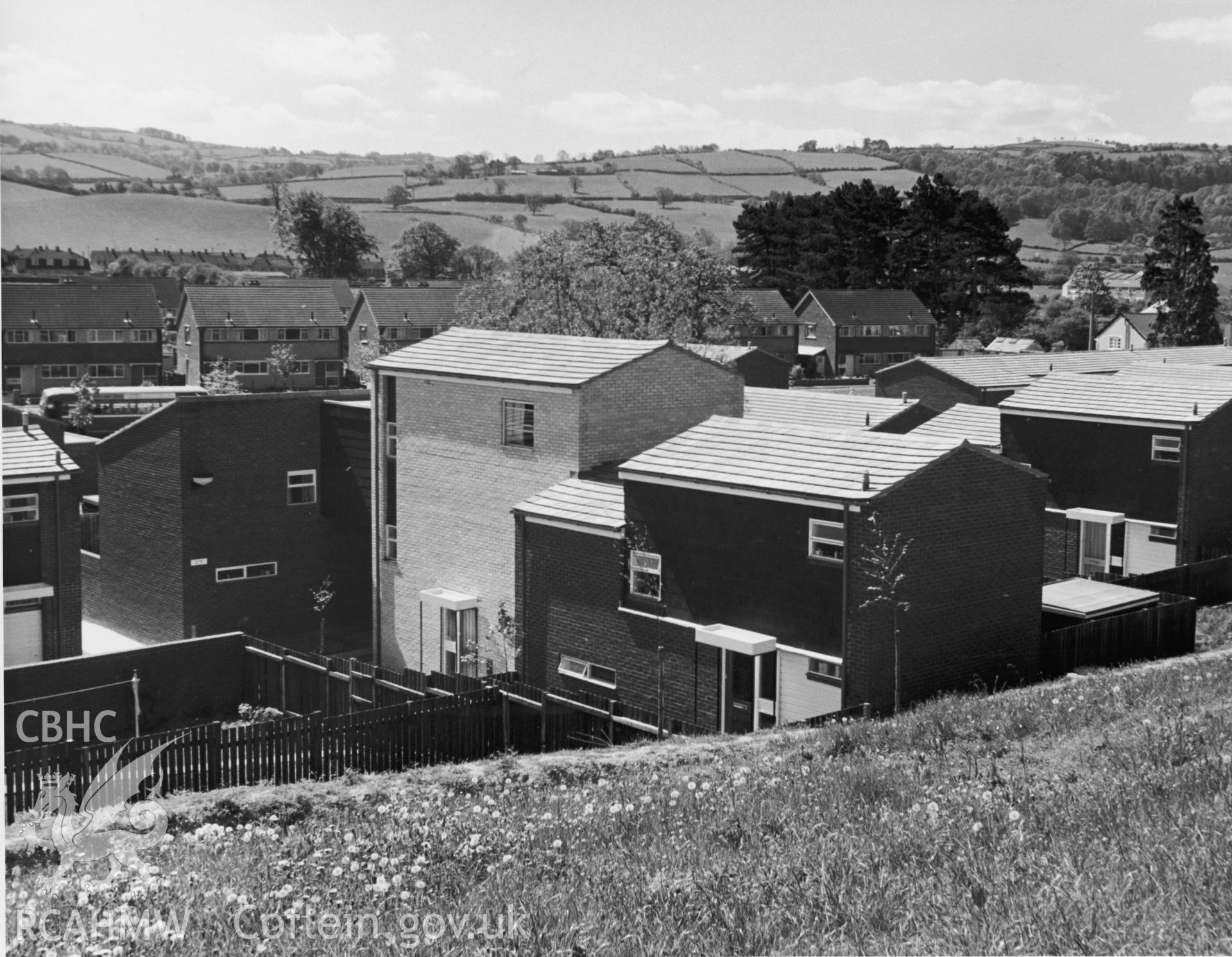 1 b/w print showing modern housing estate in Newtown, Powys; collated by the former Central Office of Information.