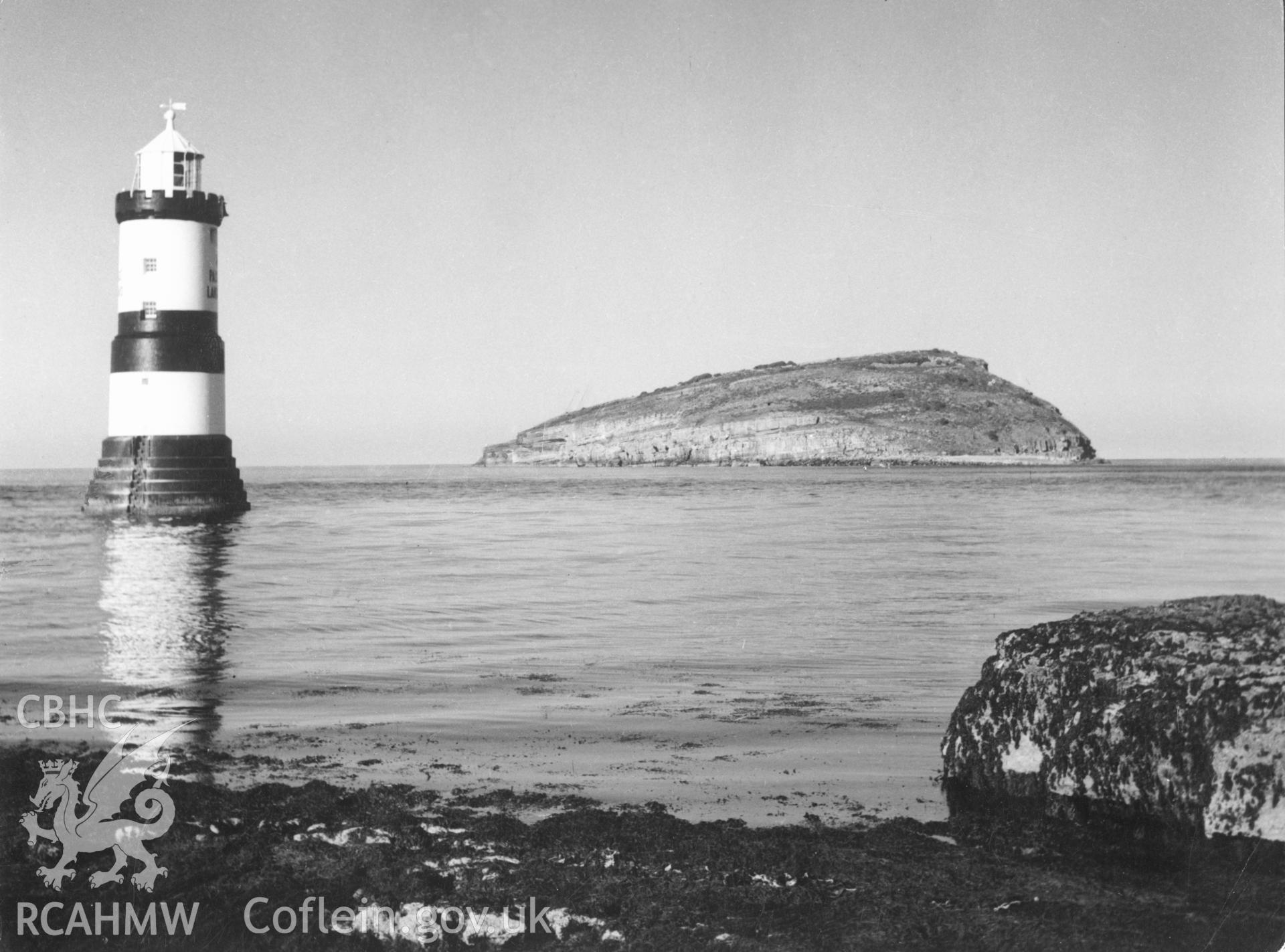 1 b/w print showing view of Trwyn-Du lighthouse and Puffin Island, Anglesey; collated by the former Central Office of Information.