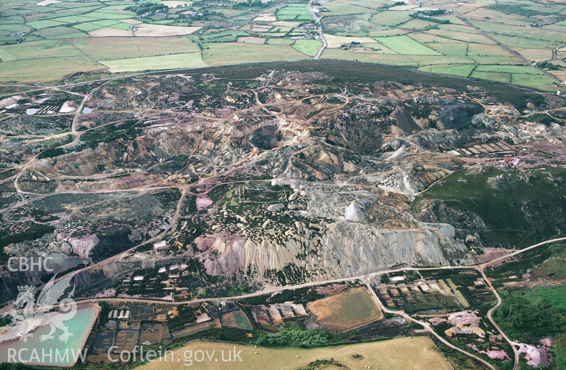 RCAHMW colour slide oblique aerial photograph of Parys Mountain Copper Mines, Amlwch, taken by C.R.Musson on the 27/07/1996