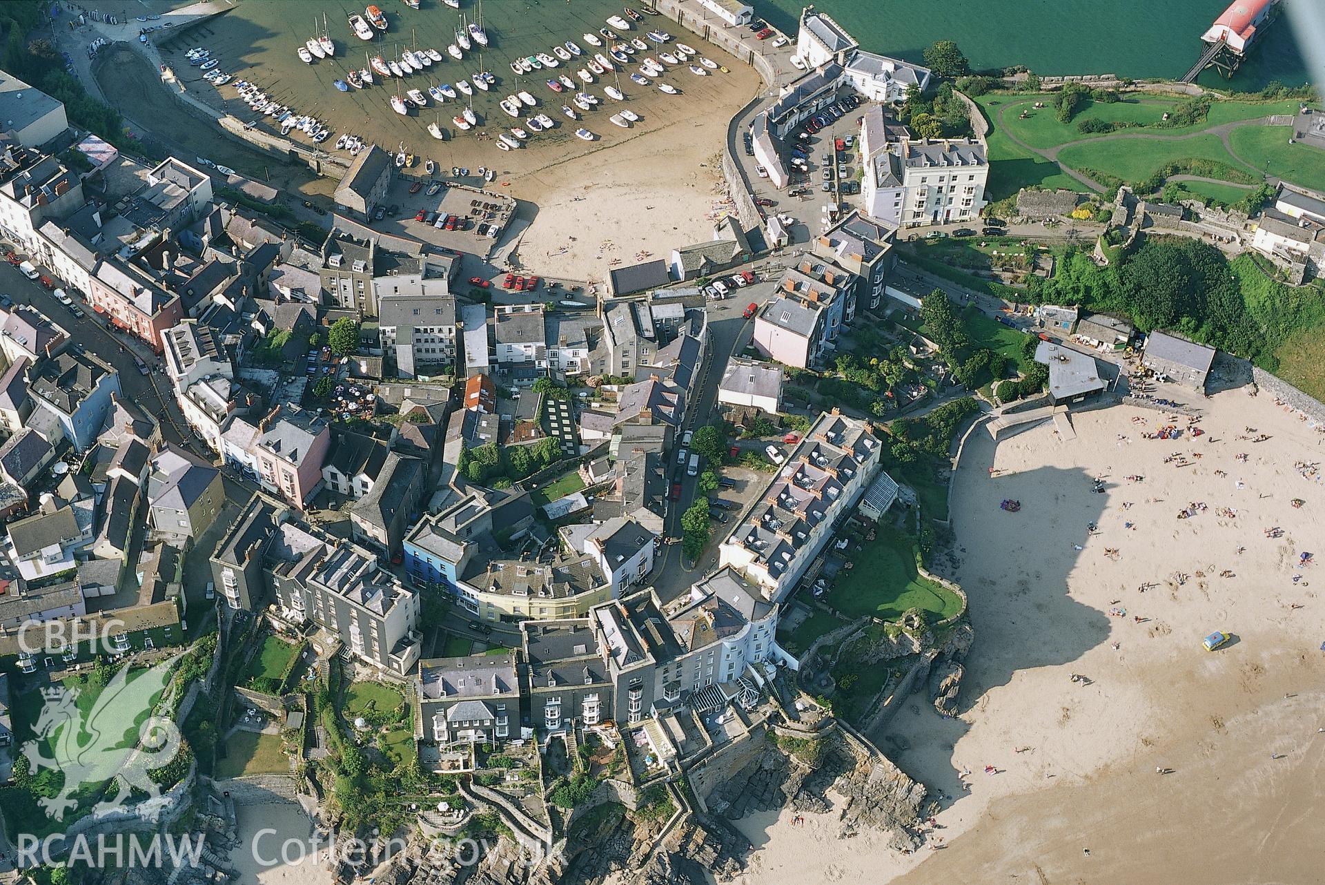 RCAHMW colour oblique aerial photograph of Tenby Town and Harbour.Taken by Toby Driver on 02/09/2002