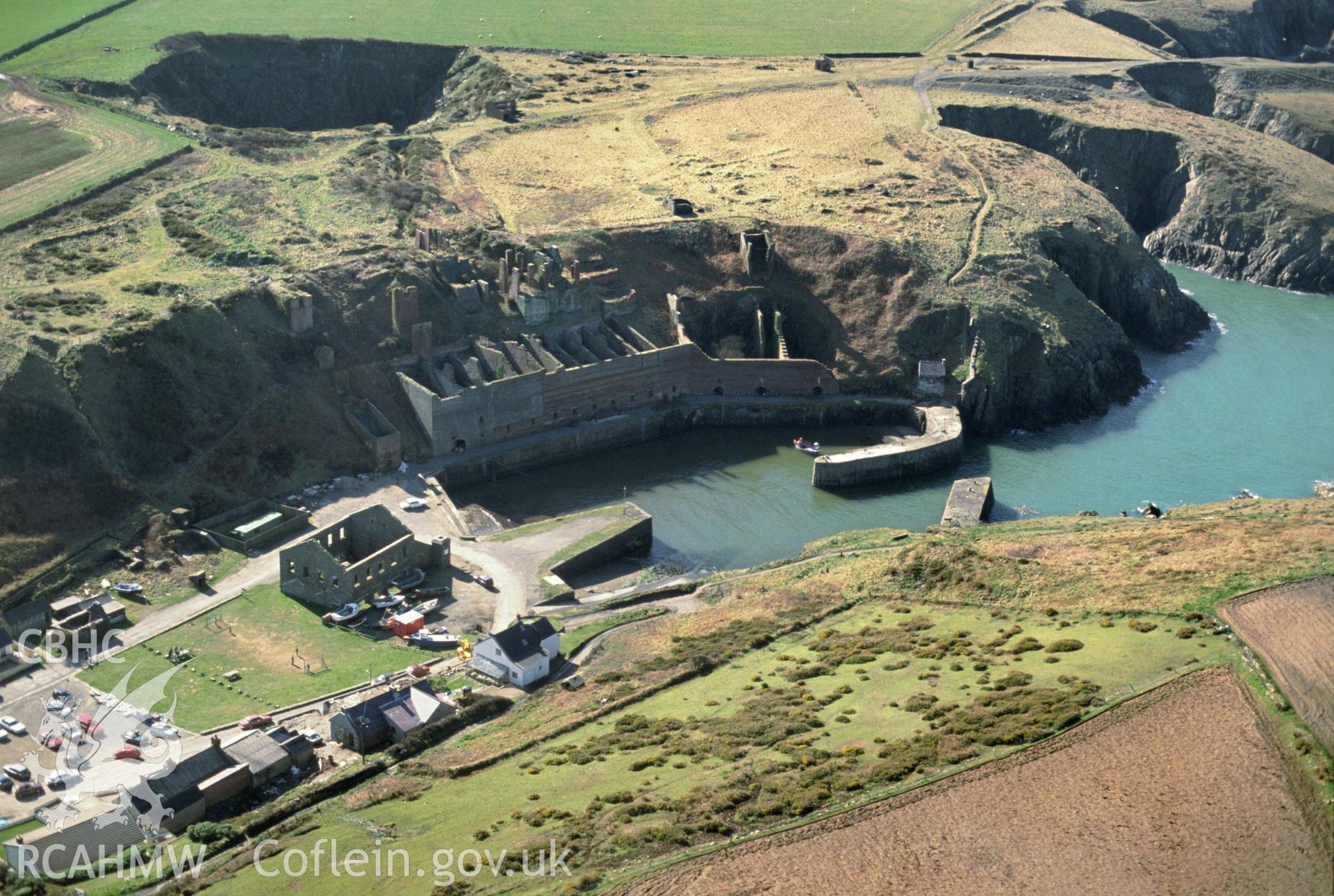 Slide of RCAHMW colour oblique aerial photograph of Porthgain Harbour and Brickworks, taken by C.R. Musson, 24/3/1991.