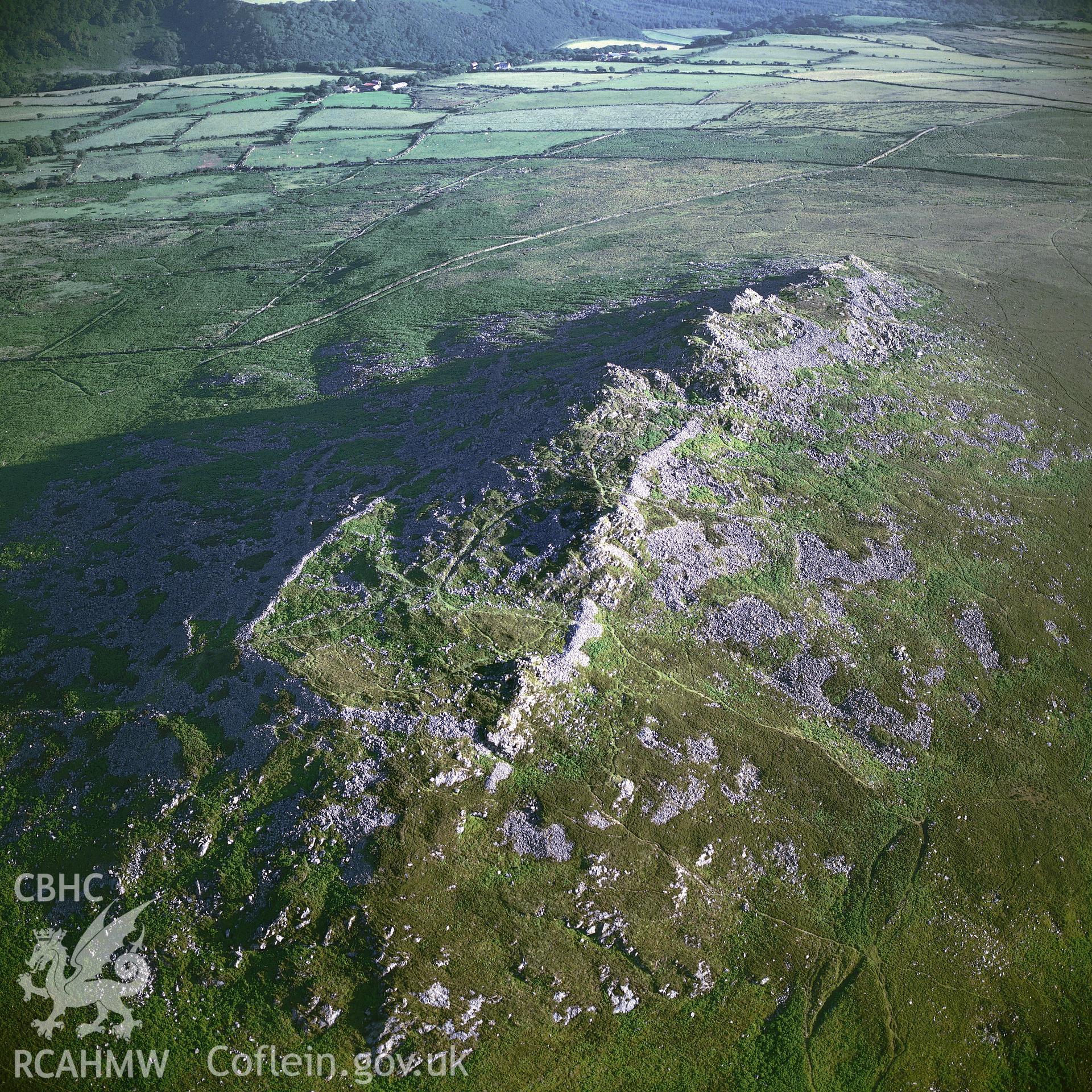 RCAHMW colour oblique aerial photograph of Carn Ingli Camp, taken by C R Musson, 1990.
