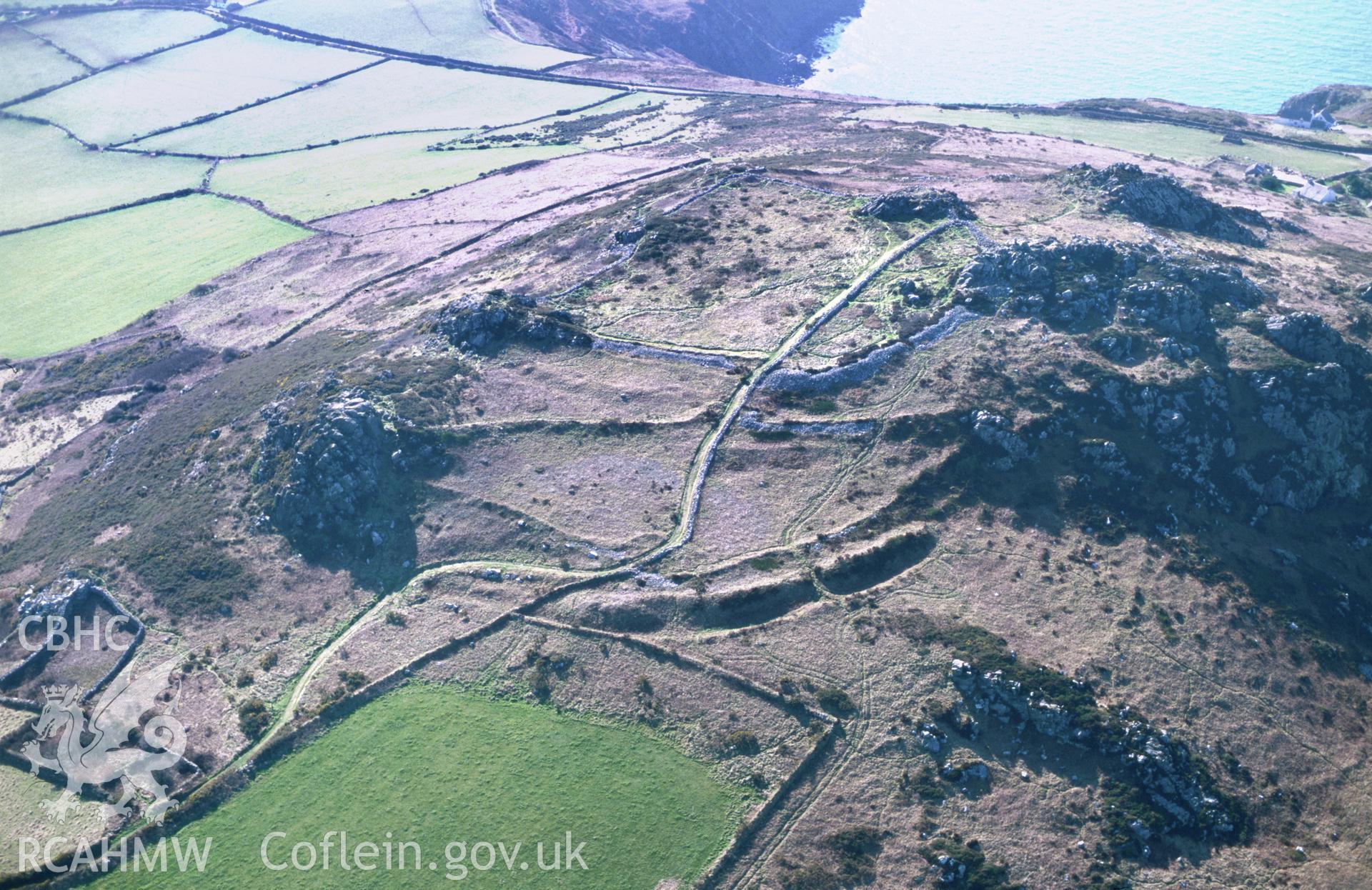 Slide of RCAHMW colour oblique aerial photograph of Garn Fawr Defended Enclosure taken by T.G. Driver, 2002.