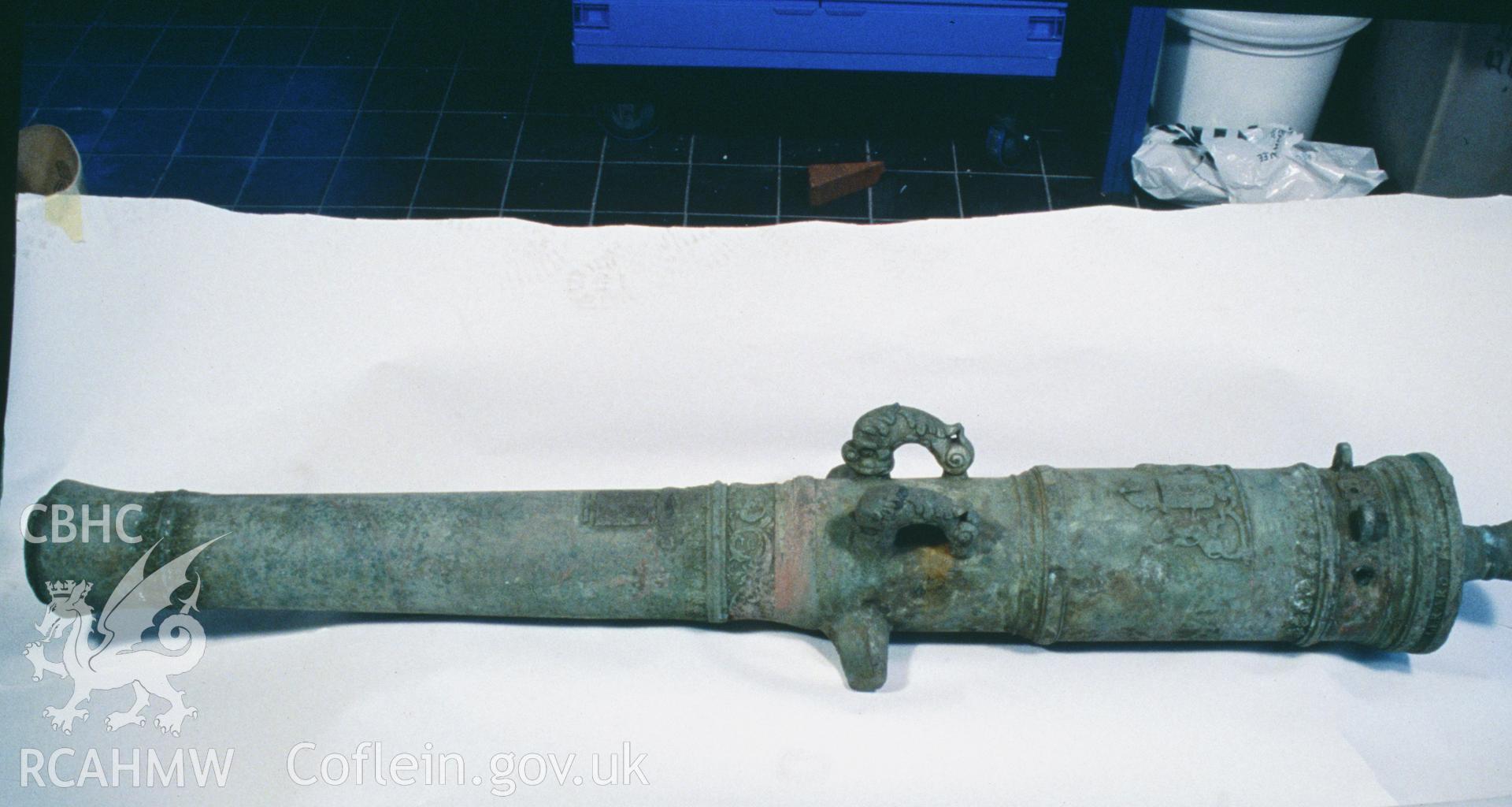 Colour slide showing well preserved gun find, with dolphin lifters, from a survey of the Mary designated shipwreck, courtesy of National Museums, Liverpool (Merseyside Maritime Museum)