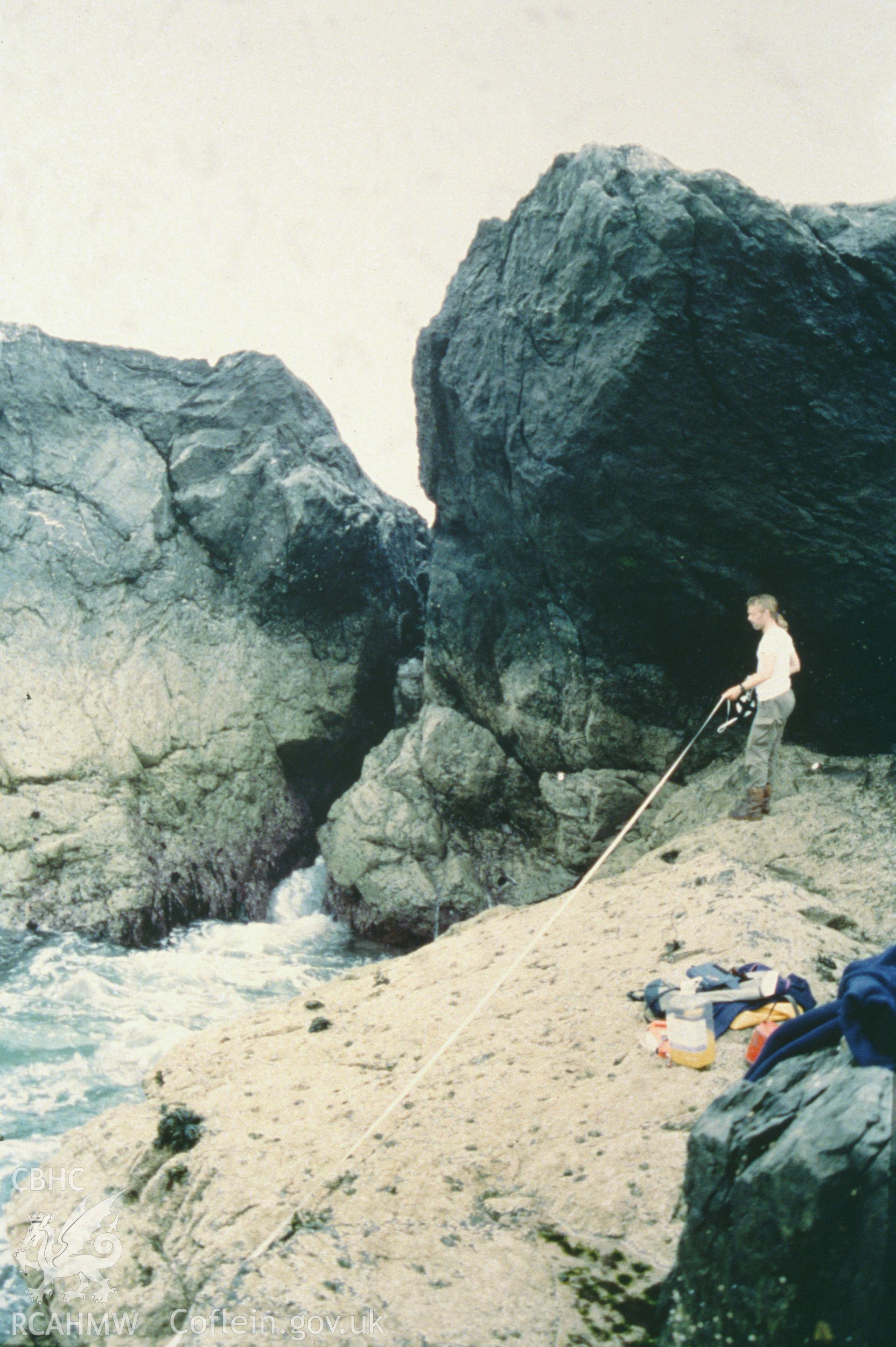 Colour slide of member of survey team at work on beach, from a survey of the Mary designated shipwreck, courtesy of National Museums, Liverpool (Merseyside Maritime Museum)