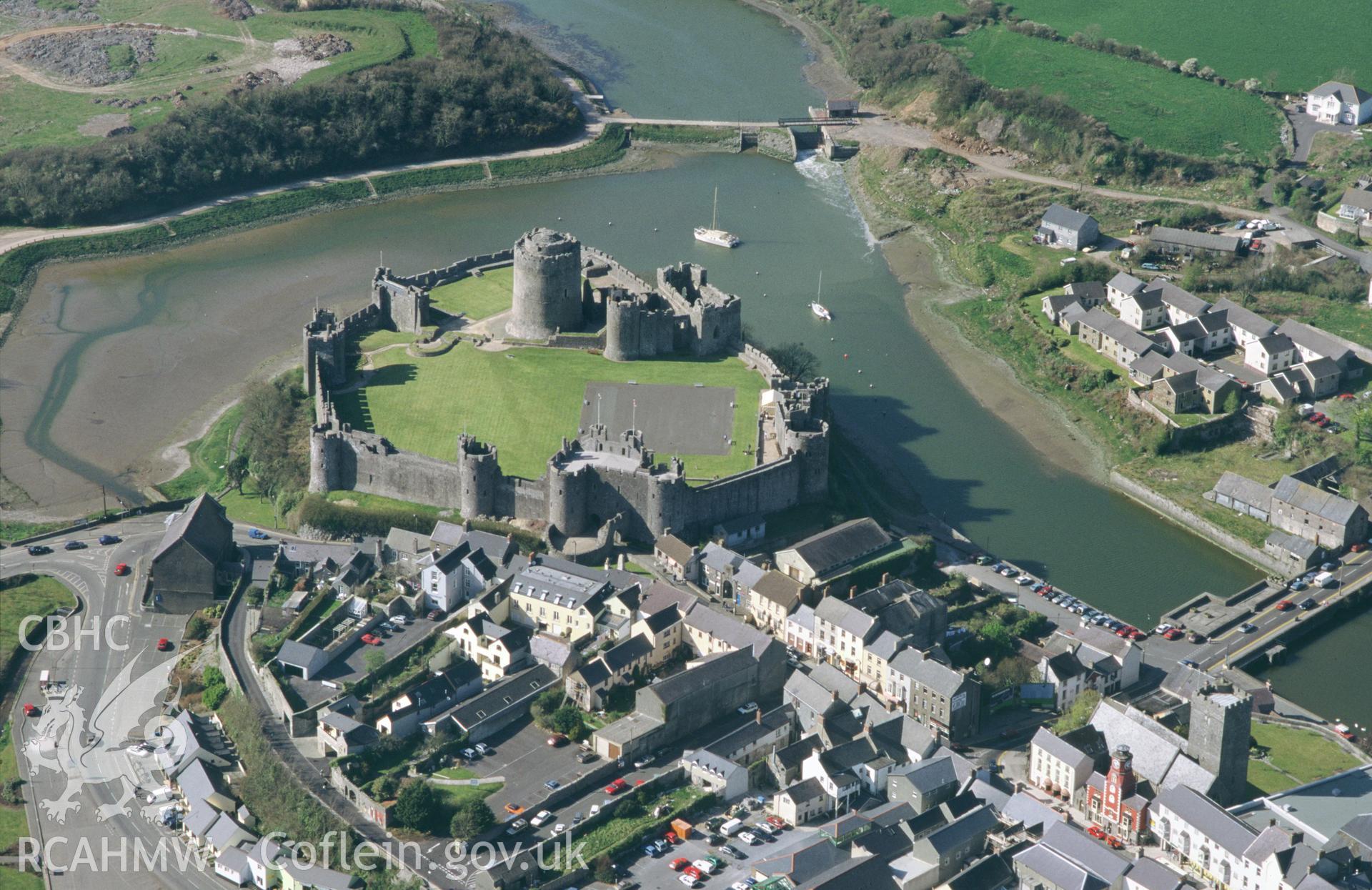 RCAHMW colour oblique aerial photograph of Pembroke Castle. Taken by C R Musson on 13/04/1995