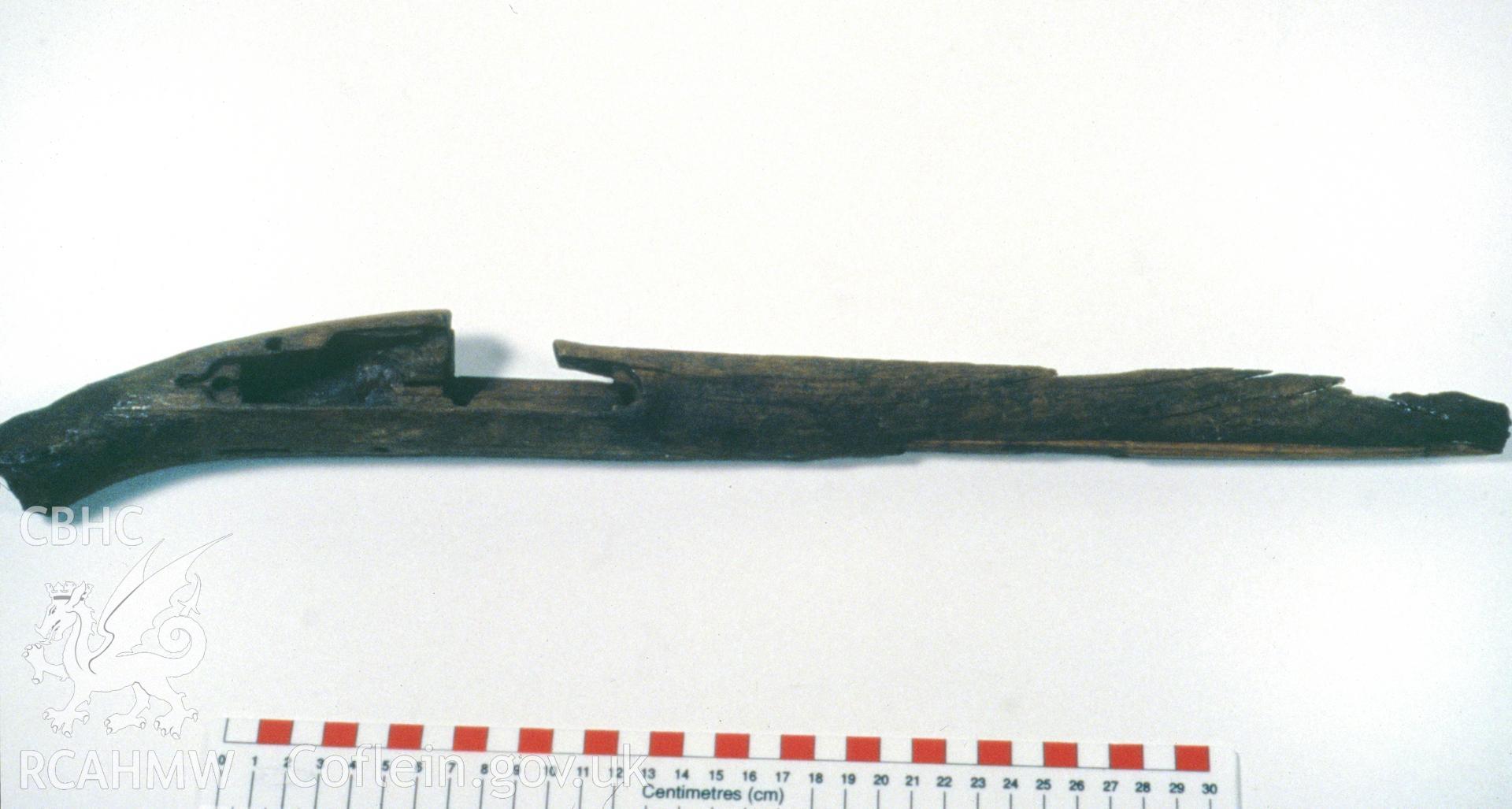 Colour slide showing find from site, wooden musket stock, from a survey of the Mary designated shipwreck, courtesy of National Museums, Liverpool (Merseyside Maritime Museum)