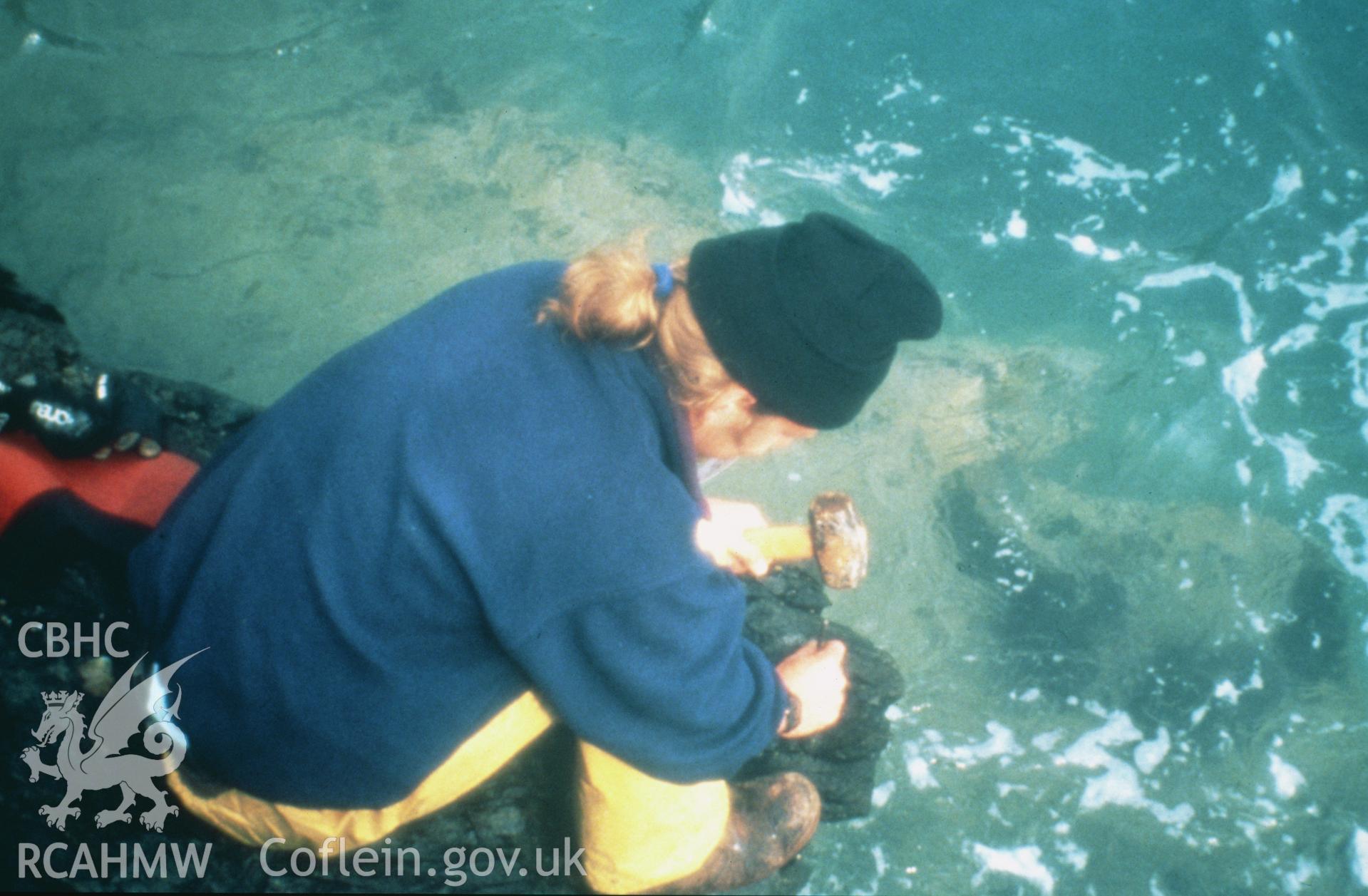 Colour slide of member of survey team working at surface, from a survey of the Mary designated shipwreck, courtesy of National Museums, Liverpool (Merseyside Maritime Museum)